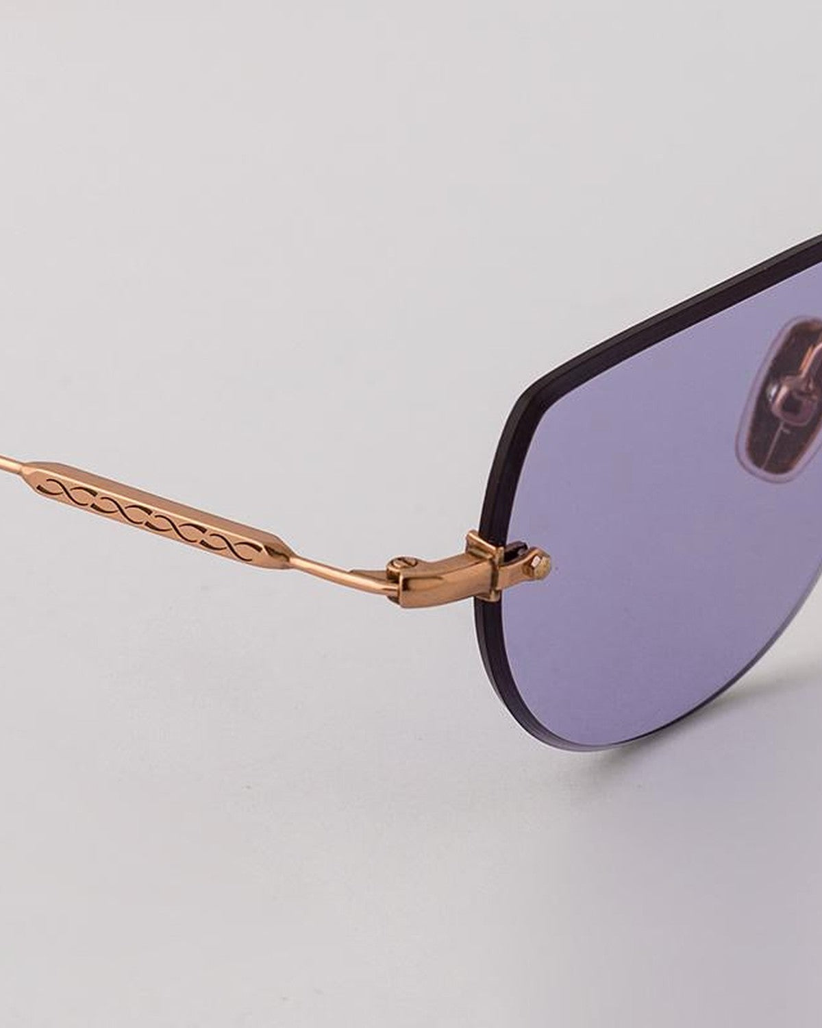 Detail of the temple hinge and decorative loop on EYEPETIZER DRIVE C.9-49 sunglasses.