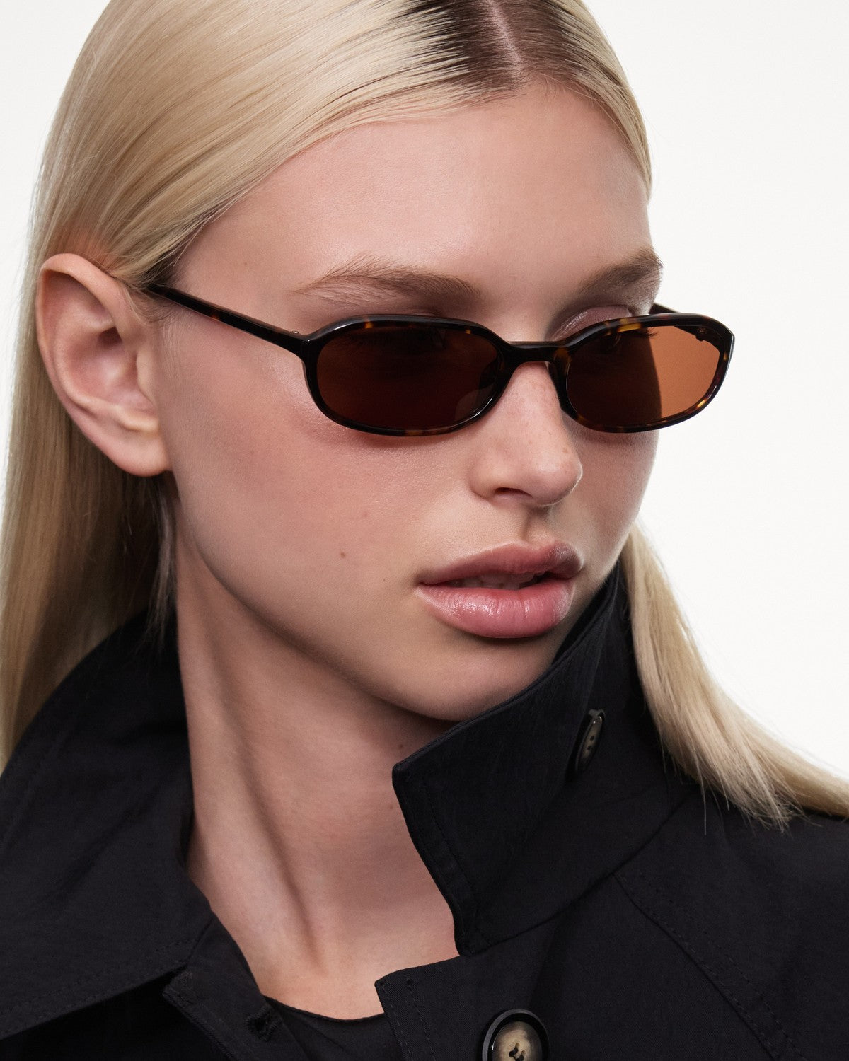 Side profile of model wearing CHIMI Edith Tortoise Brown sunglasses.