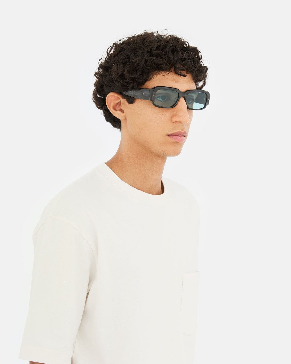 Model wearing RETROSUPERFUTURE Etrusco Fiammato sunglasses, side profile.