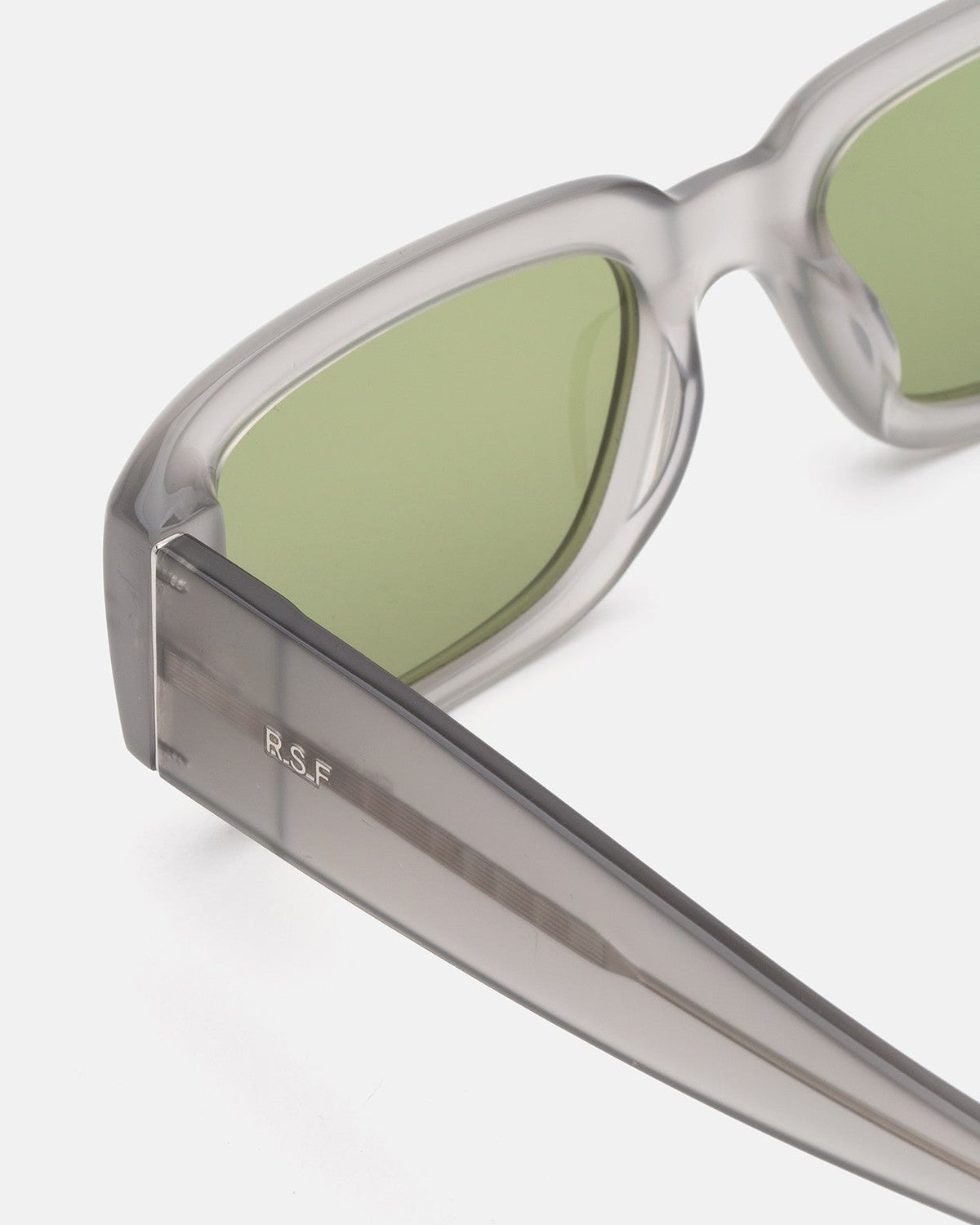 Detail of the temple showing brand engraving on RETROSUPERFUTURE Etrusco Light Grey sunglasses.
