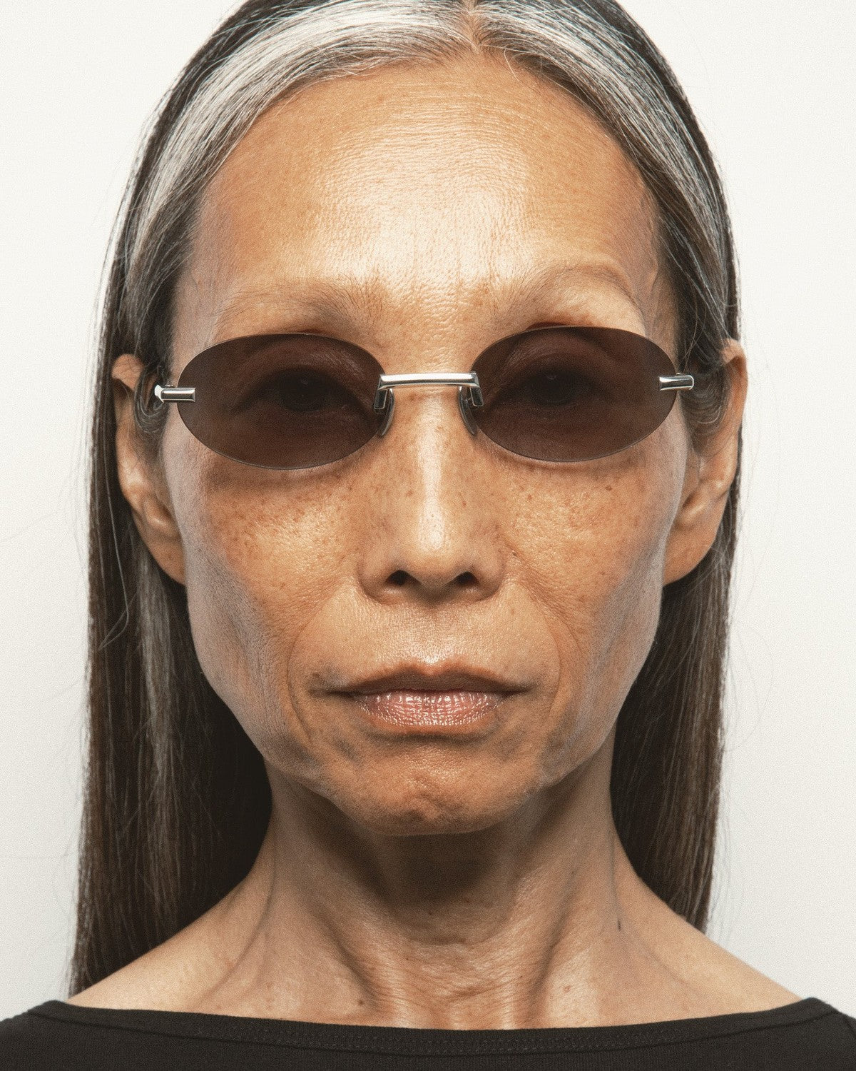 Model wearing KALEOS Fuentes Silver Black Gradient sunglasses.