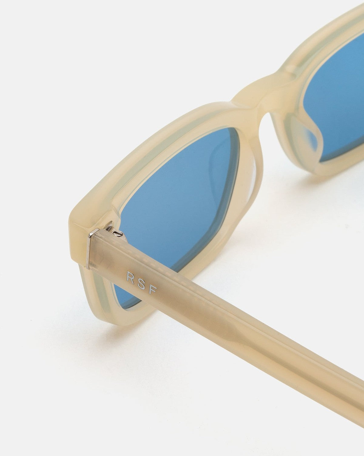 Close-up of the metal hinge detail on RETROSUPERFUTURE Gesto Cremoso sunglasses.