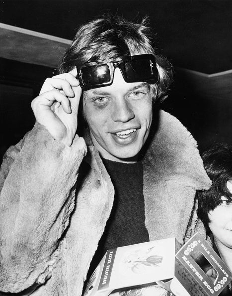 Person wearing futuristic goggles with a dark background