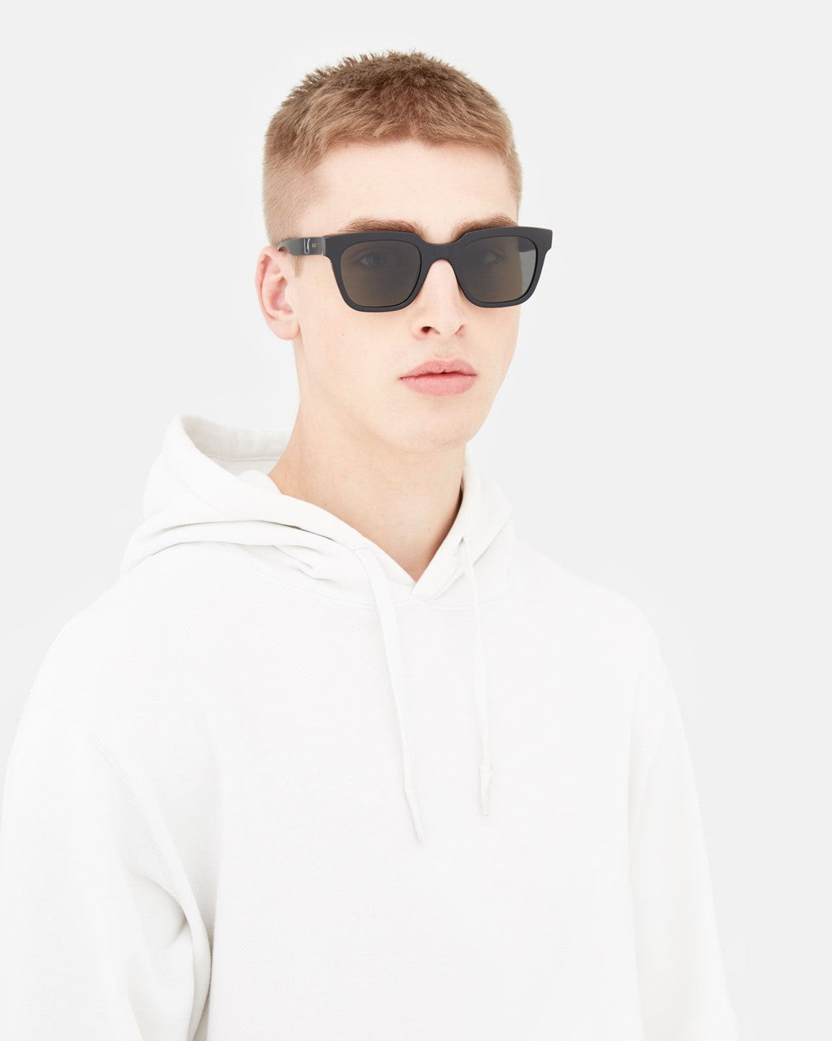 Model wearing RETROSUPERFUTURE Giusto Black sunglasses.
