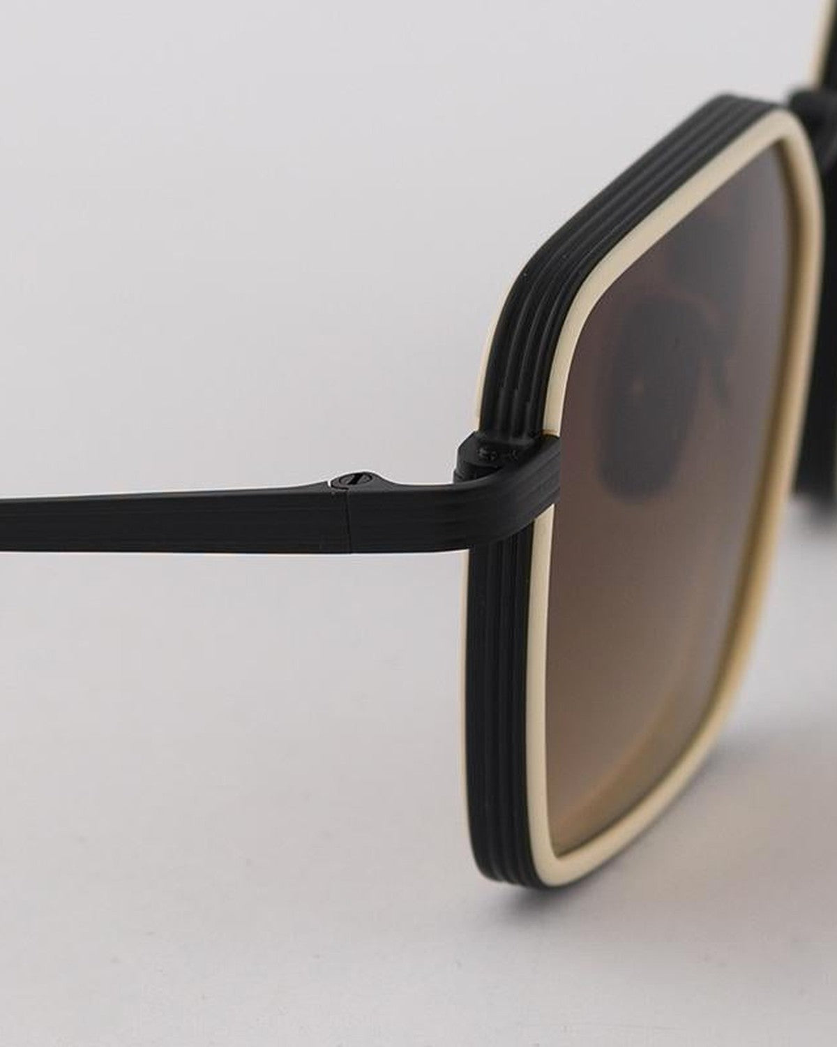Close-up of the temple hinge on EYEPETIZER GLIDE C.CY-6-50 sunglasses.