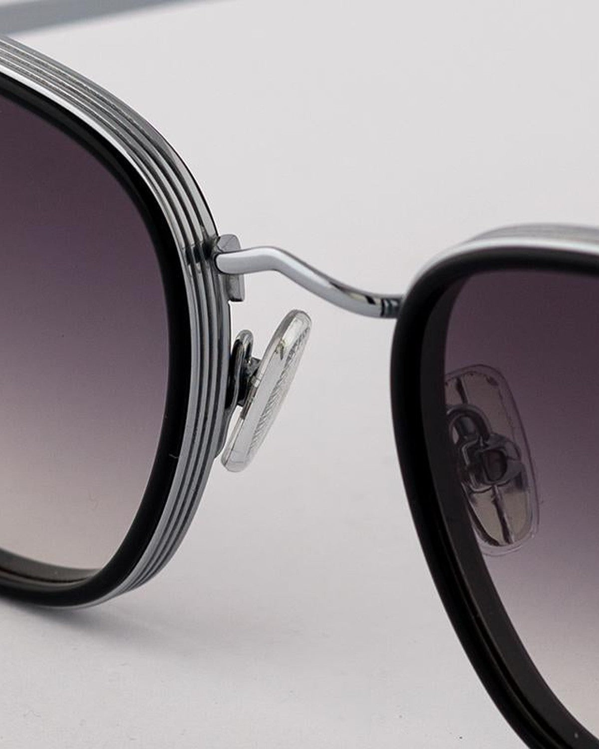 Close-up of the nose bridge and decorative temple detailing on EYEPETIZER GLIDE C.A-1-27 sunglasses.