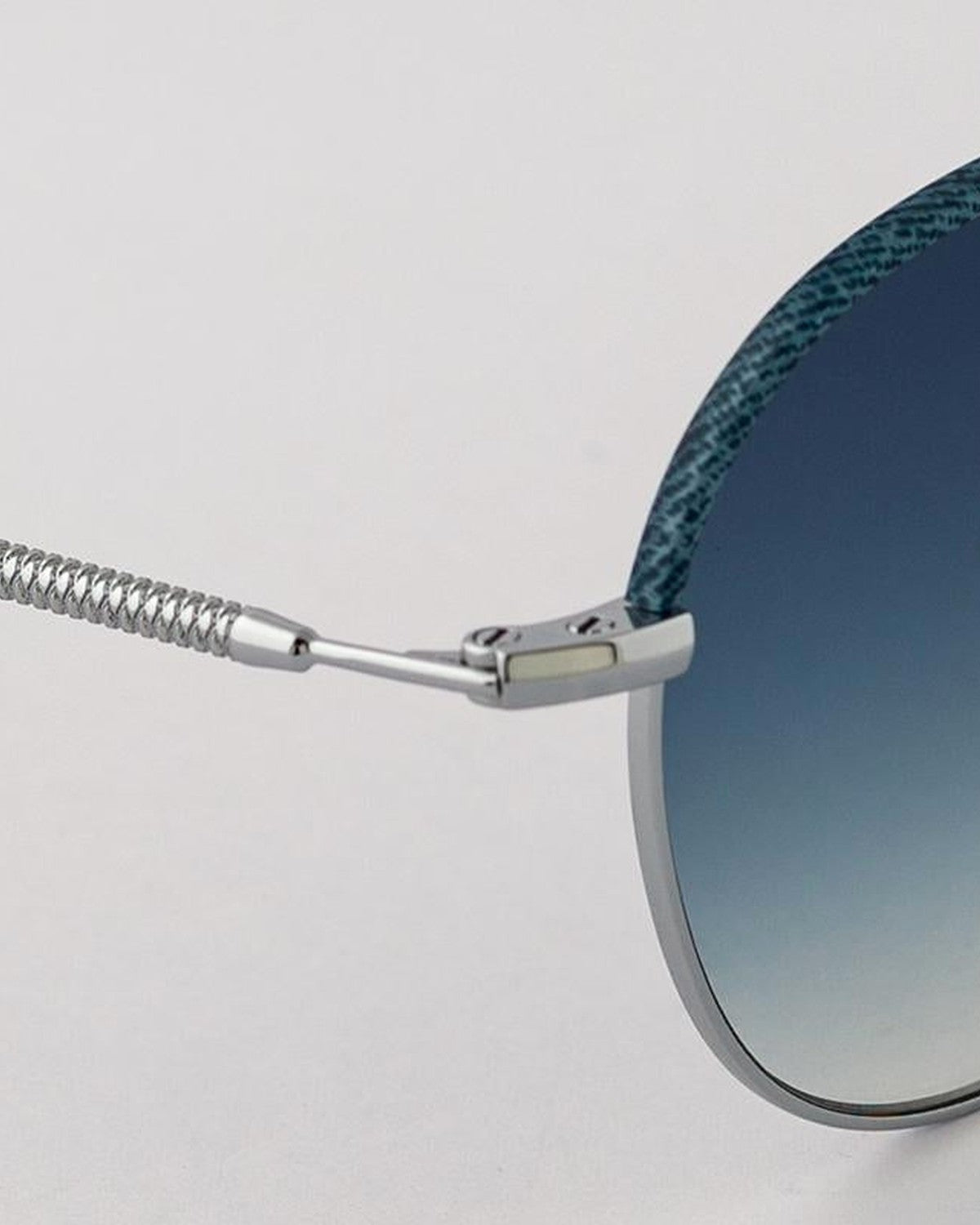 Close-up of the coiled temple cable on EYEPETIZER GOBI C.1-R-26 sunglasses.
