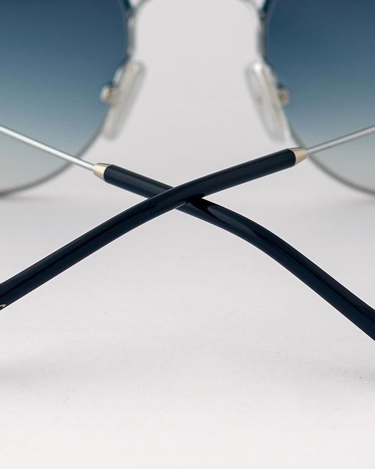 Detail of crossed temple tips on EYEPETIZER GOBI C.1-R-26 sunglasses.