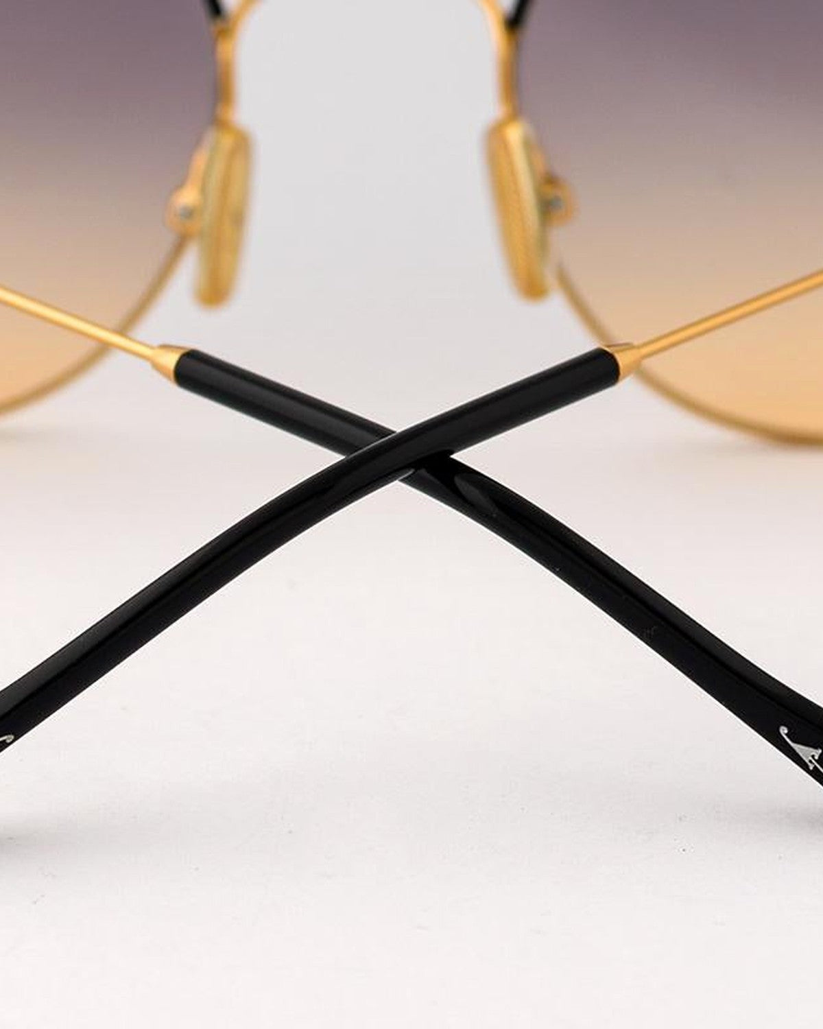 Detail of the crossed temples showing black acetate tips on EYEPETIZER GOBI C.4-A-19 sunglasses.