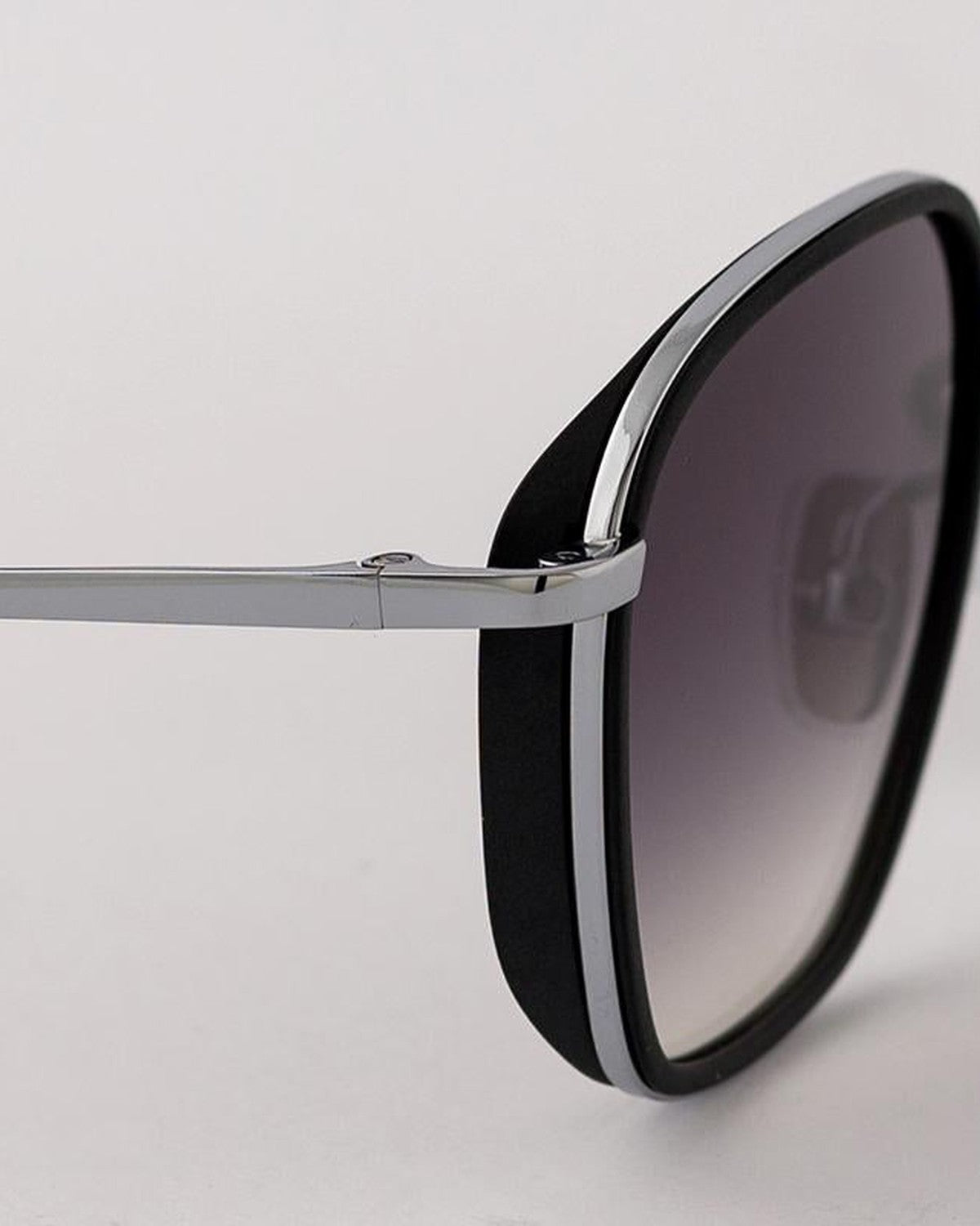 Angled close-up of the temple and gradient lens of EYEPETIZER HONORE' C.B-1-27 sunglasses.