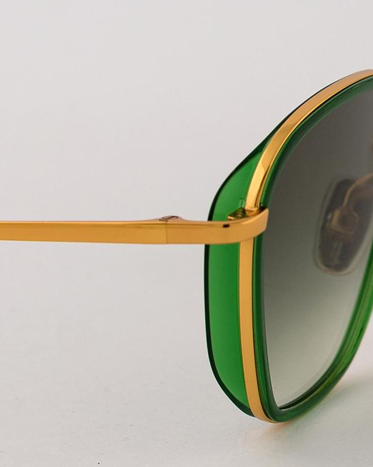 Close-up of the temple and green acetate rim on EYEPETIZER HONORE' C.O/O-4-25 sunglasses.