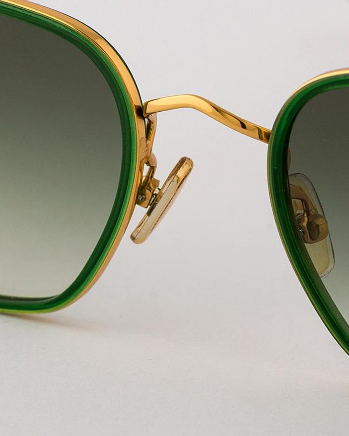 Detail of the gold bridge and adjustable nose pads on EYEPETIZER HONORE' C.O/O-4-25 sunglasses.