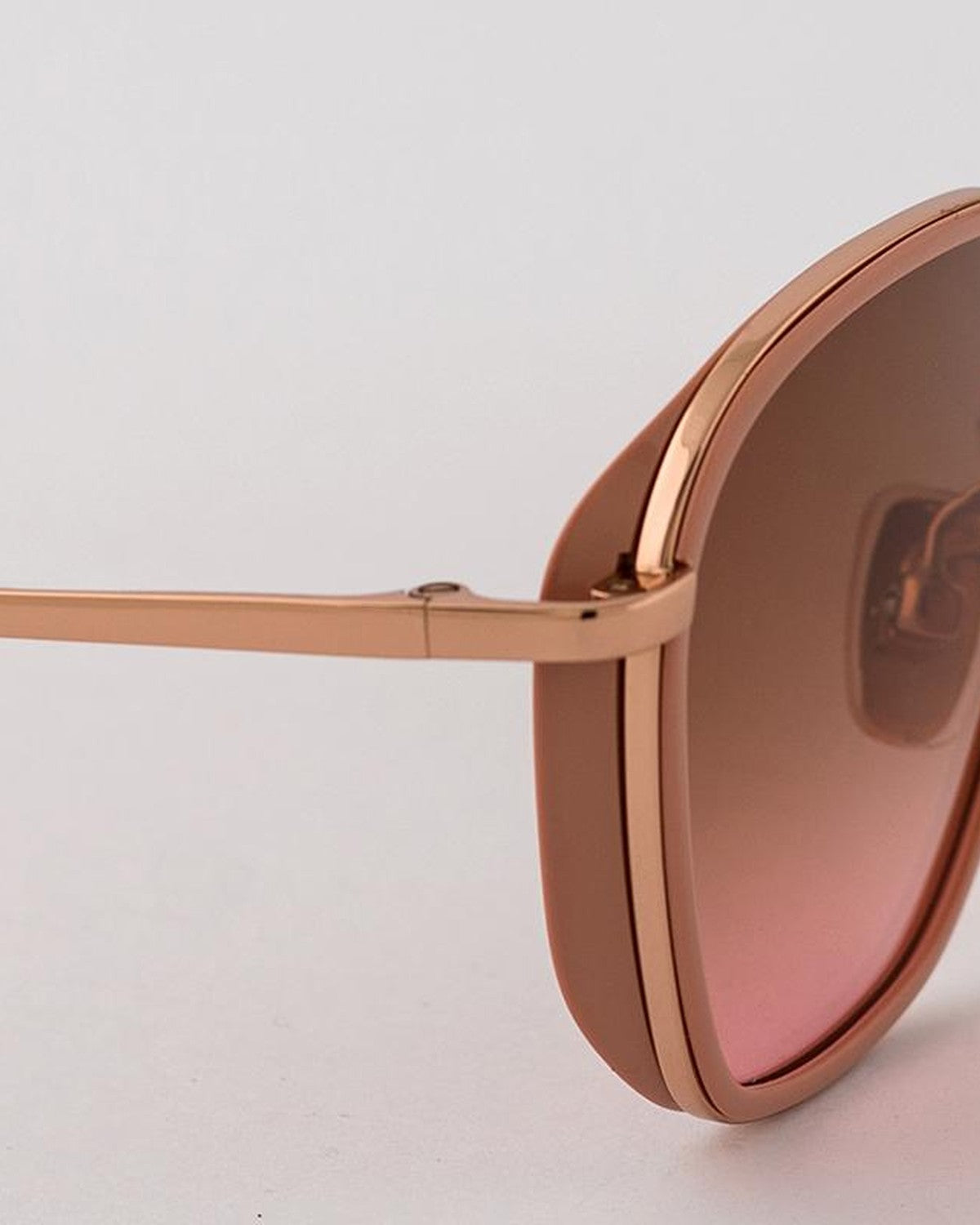 Close-up of the temple hinge and gradient lens on EYEPETIZER HONORE' C.Q-9-44 sunglasses.