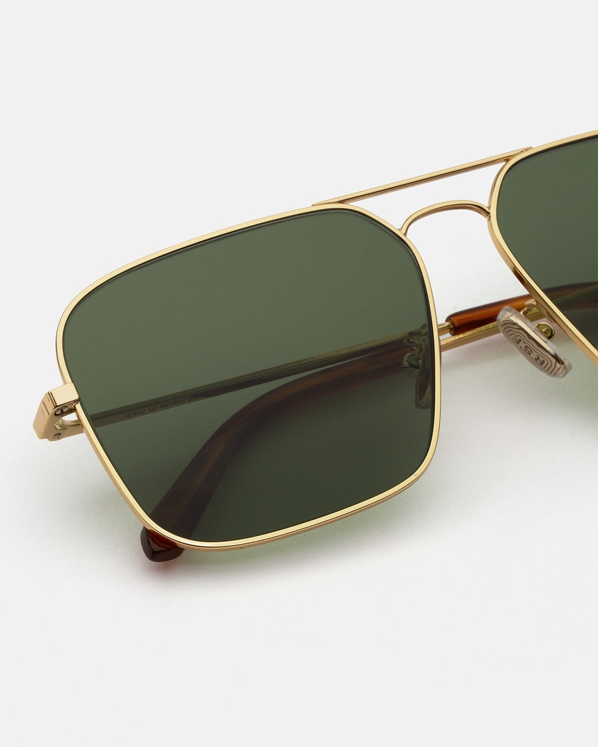 Close-up of the metal frame and hinge on RETROSUPERFUTURE Iggy 2.0 Green sunglasses.