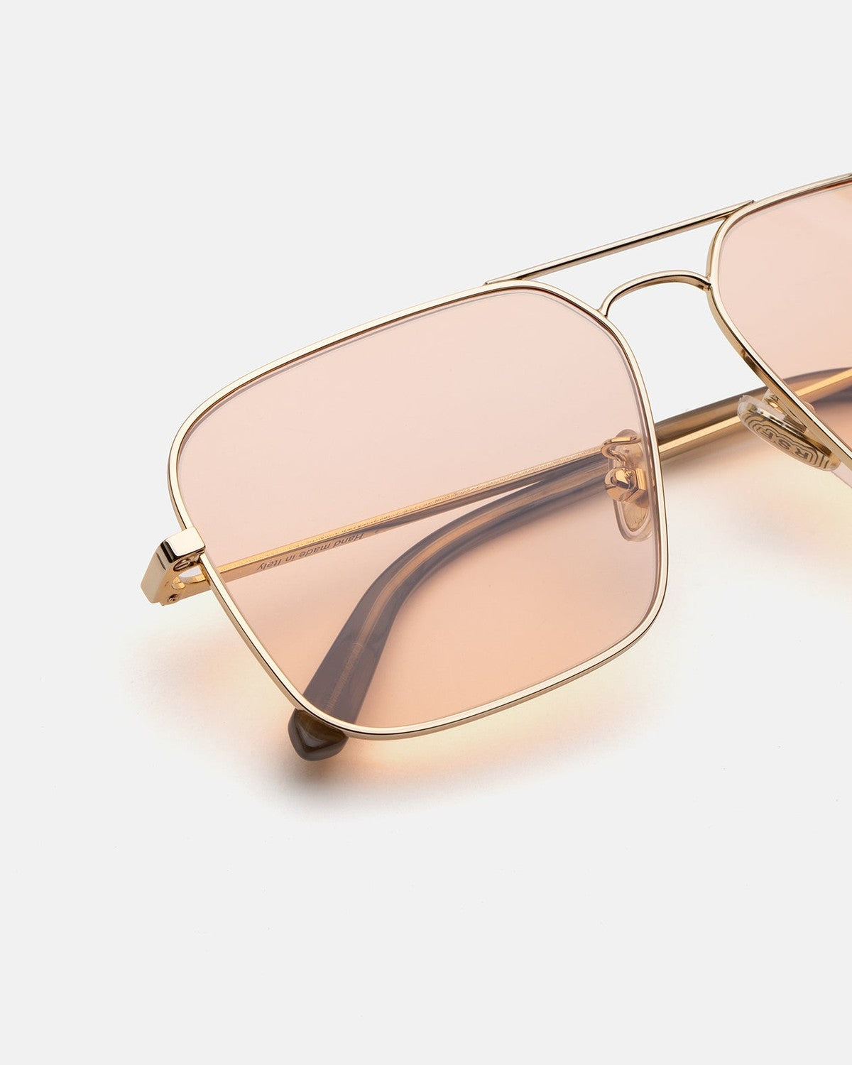 Close-up of the double bridge and lens on RETROSUPERFUTURE Iggy 2.0 Pink sunglasses.