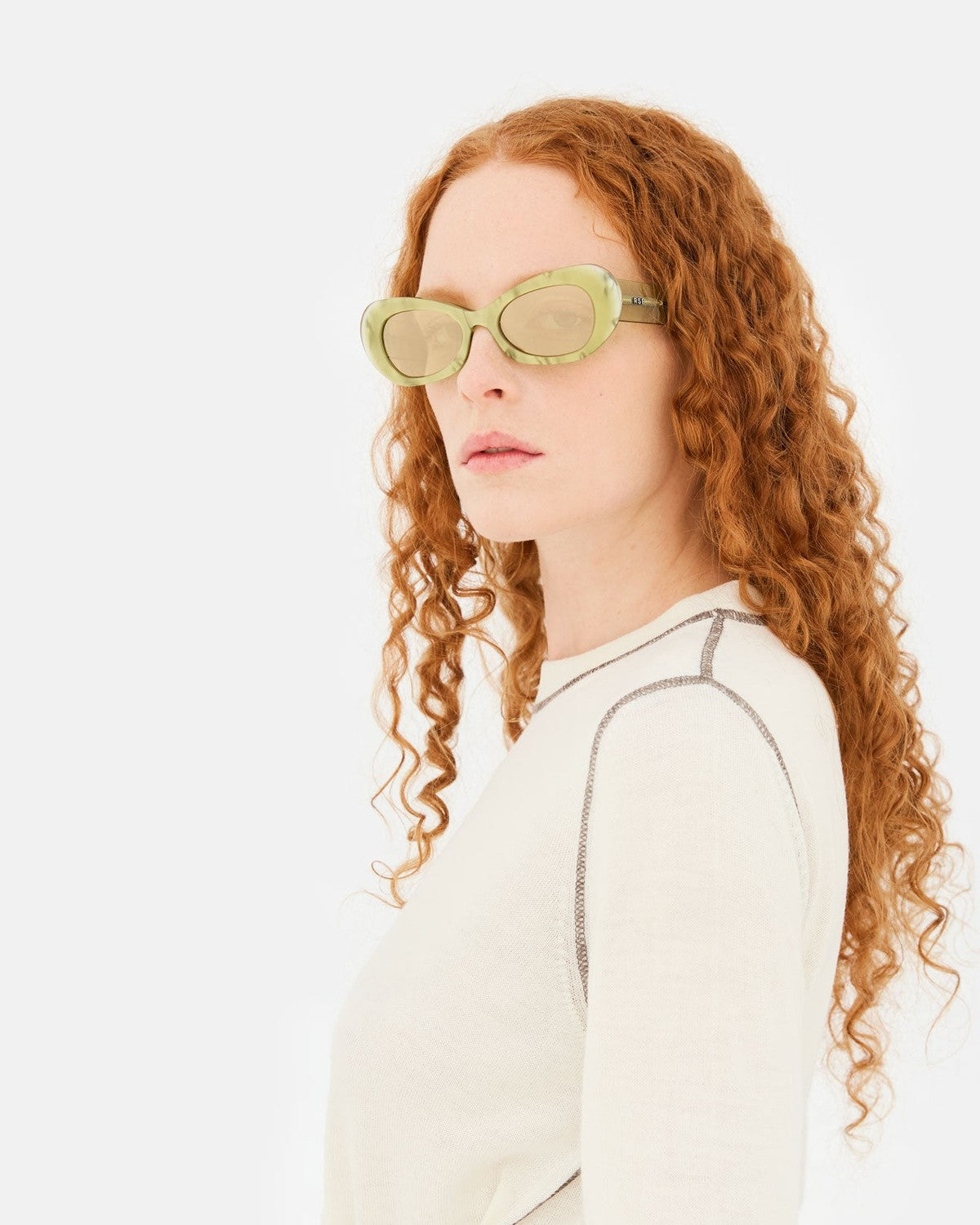 Model wearing RETROSUPERFUTURE Izipho Mindless sunglasses, profile view.