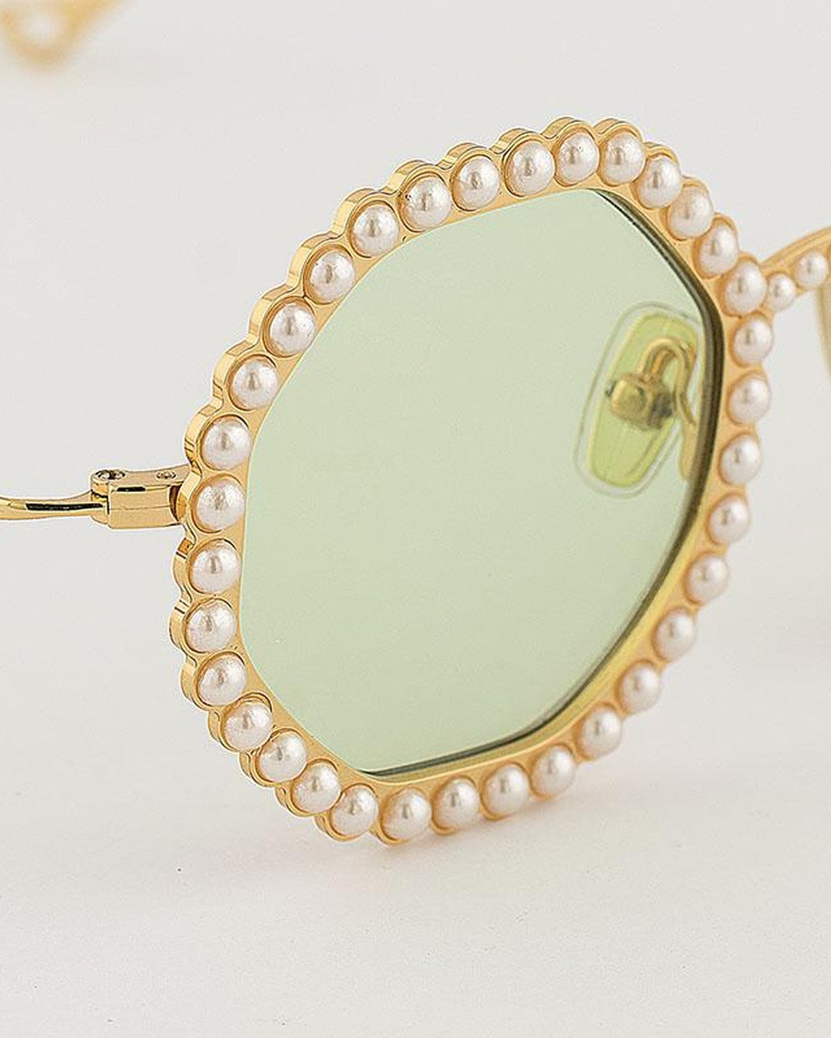 Close-up of the pearl detailing on EYEPETIZER JORDAN C.4-1 sunglasses.