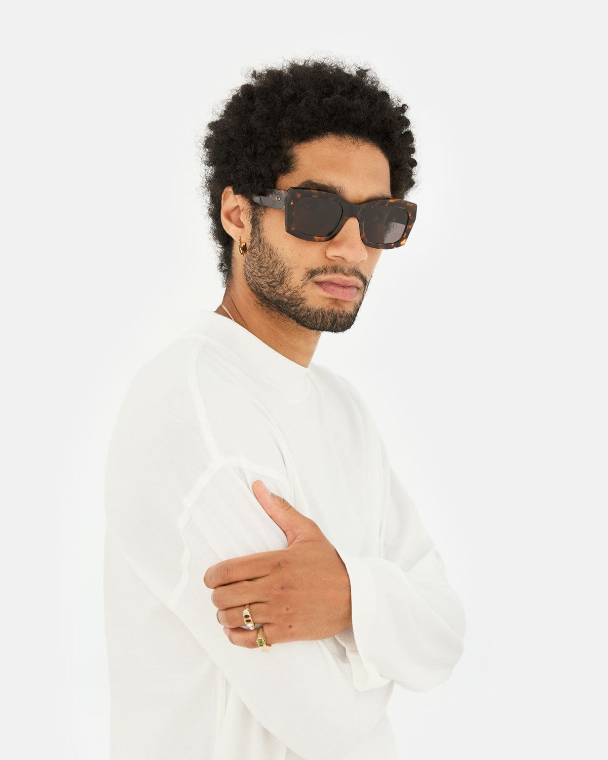 Model wearing RETROSUPERFUTURE Komori Burnt Havana sunglasses with white shirt.