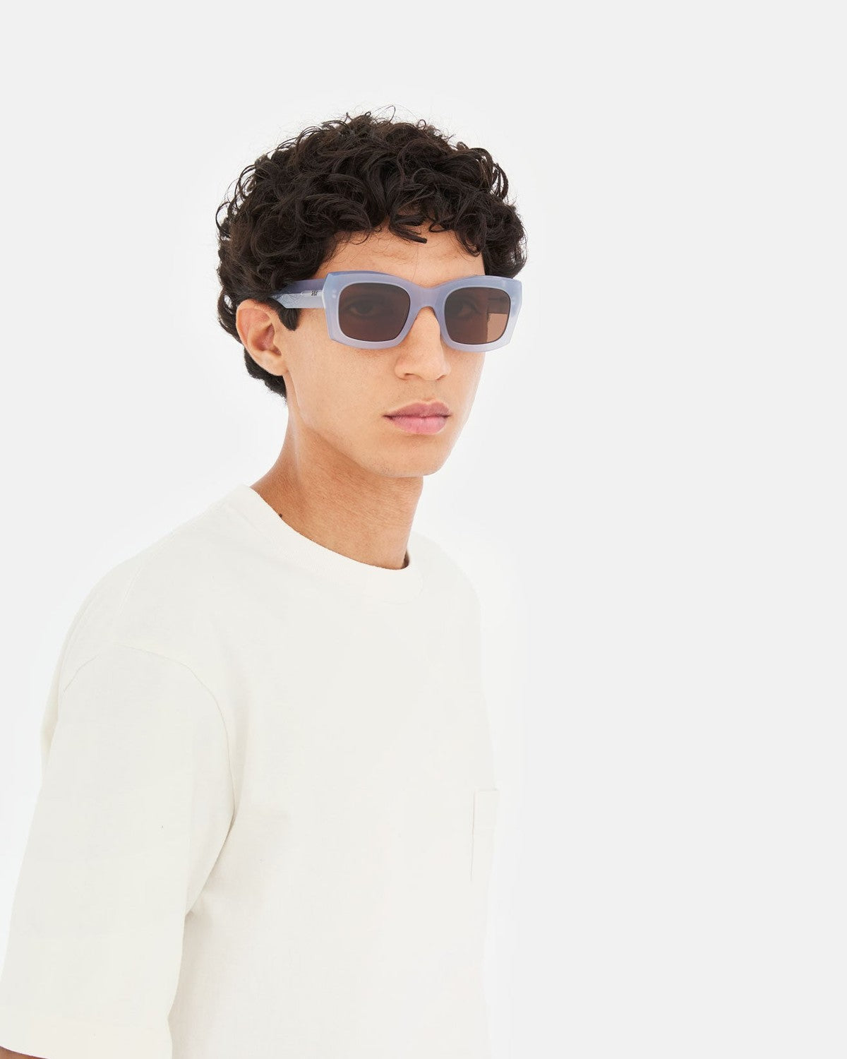 Model wearing RETROSUPERFUTURE Komori Light Blue sunglasses.