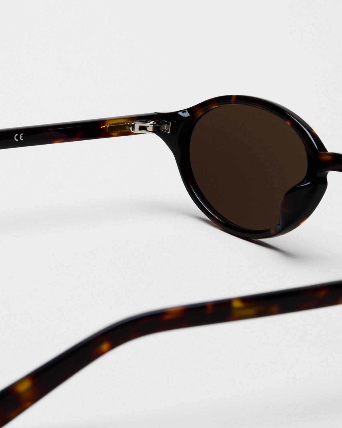 Close-up of the metal hinge on CHIMI Lex Tortoise Brown sunglasses.