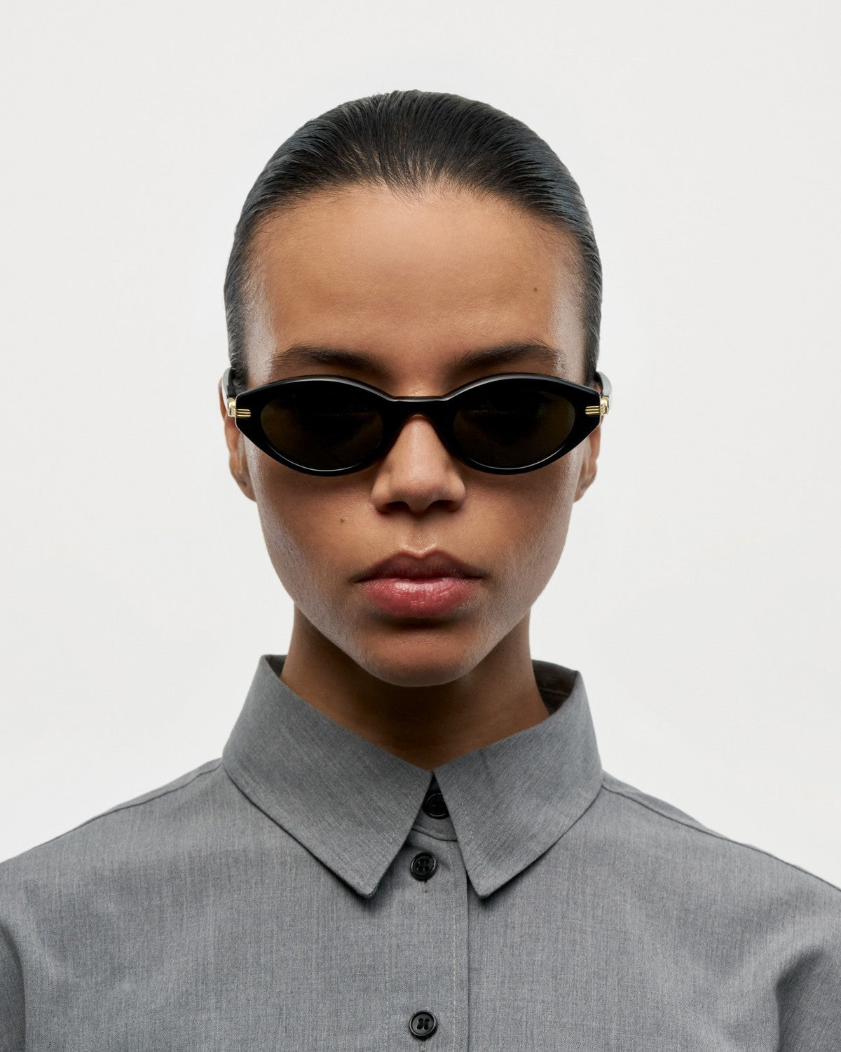 Model wearing CHIMI Lou Black sunglasses, front view.