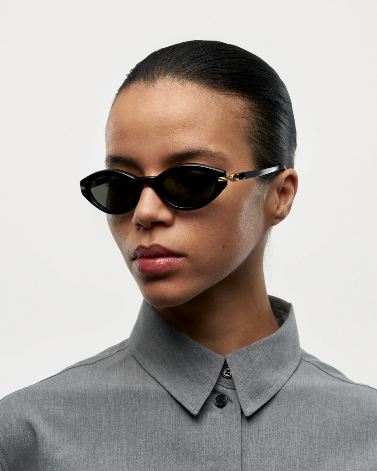 Model wearing CHIMI Lou Black sunglasses, side angle view.