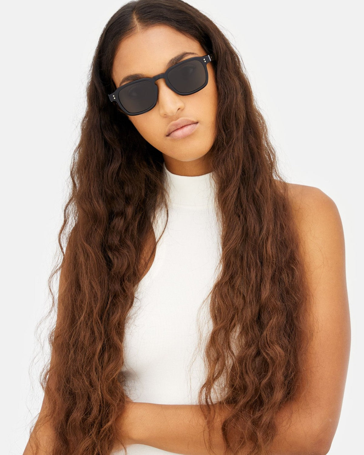 Model wearing RETROSUPERFUTURE Luce Black sunglasses.