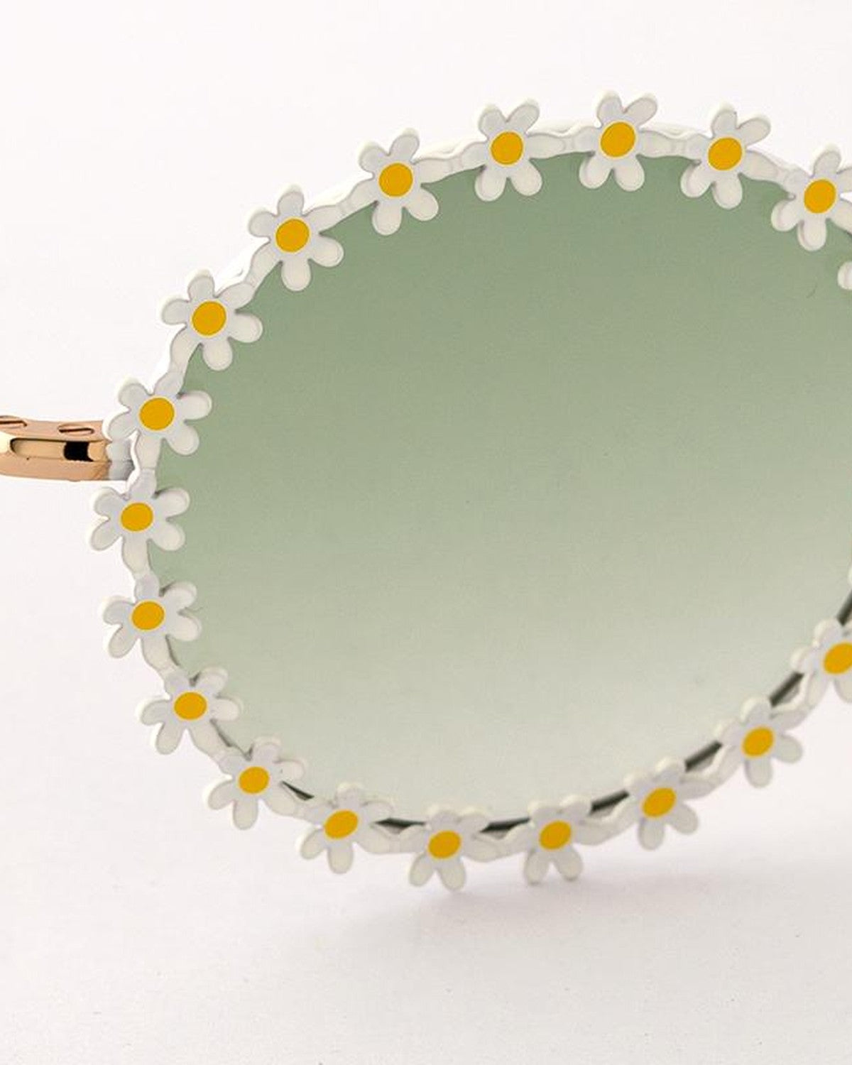 Close-up of daisy detailing around the lens rim of EYEPETIZER LULU' C.4/16-31 sunglasses.