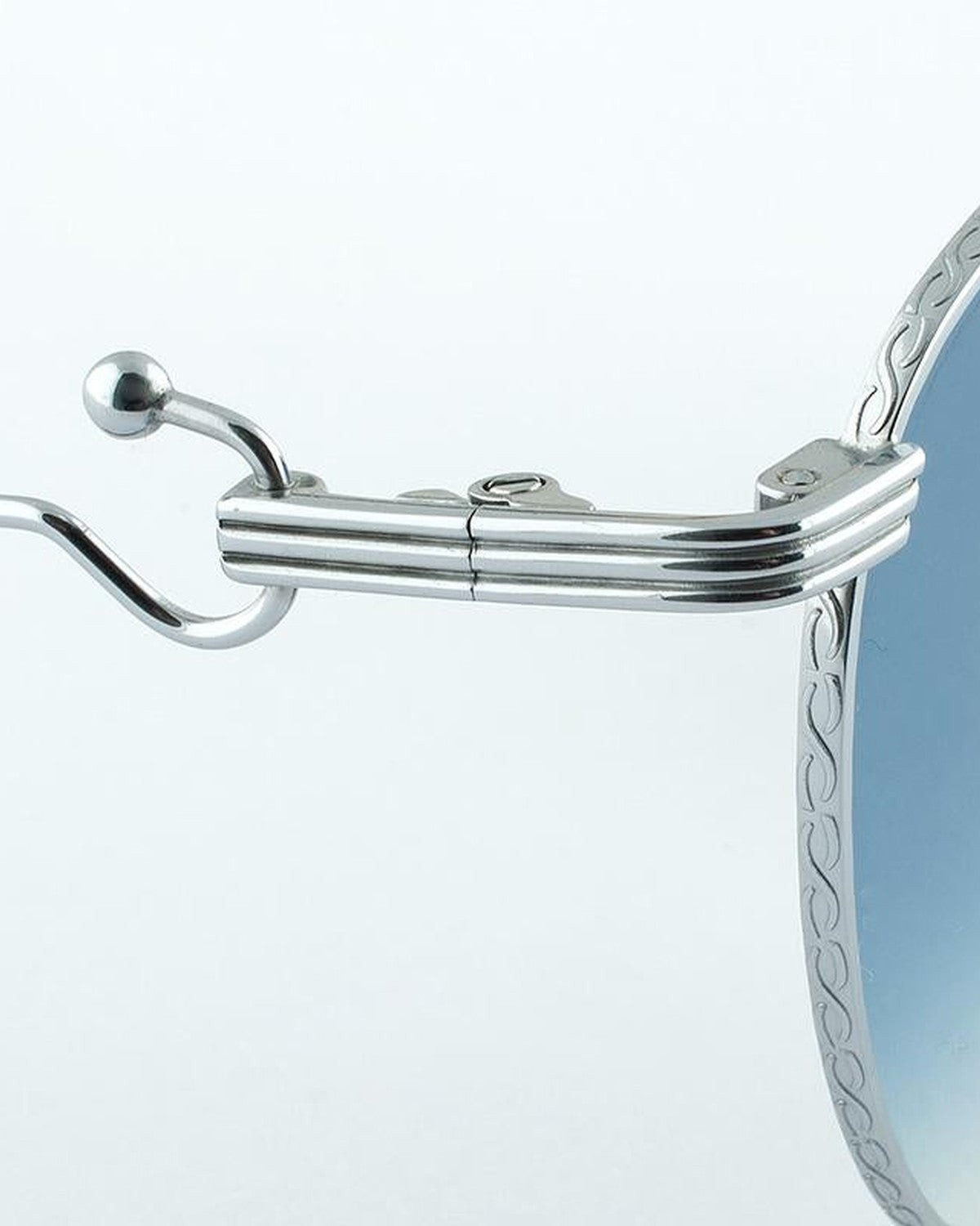 Close-up of the temple tip and hinge mechanism on EYEPETIZER LUNE C.1-26F sunglasses.