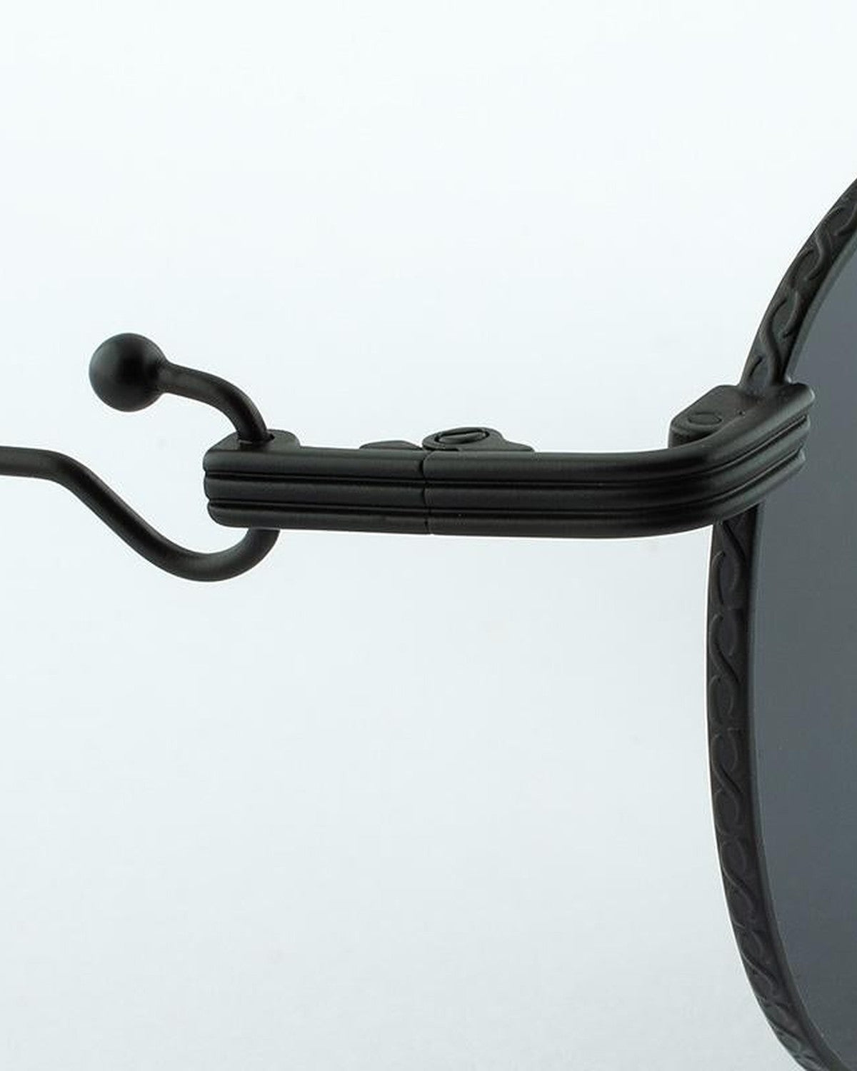 Close-up of the decorative temple tip on EYEPETIZER LUNE C.6-7 sunglasses.