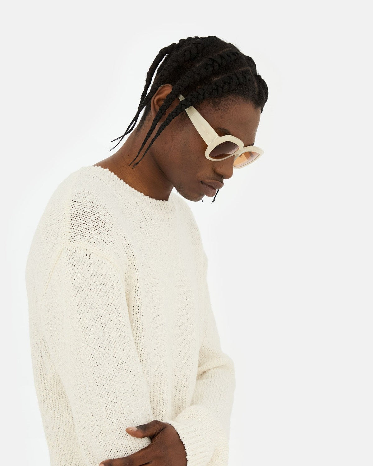 Side profile of model wearing RETROSUPERFUTURE Nala Cremoso sunglasses.