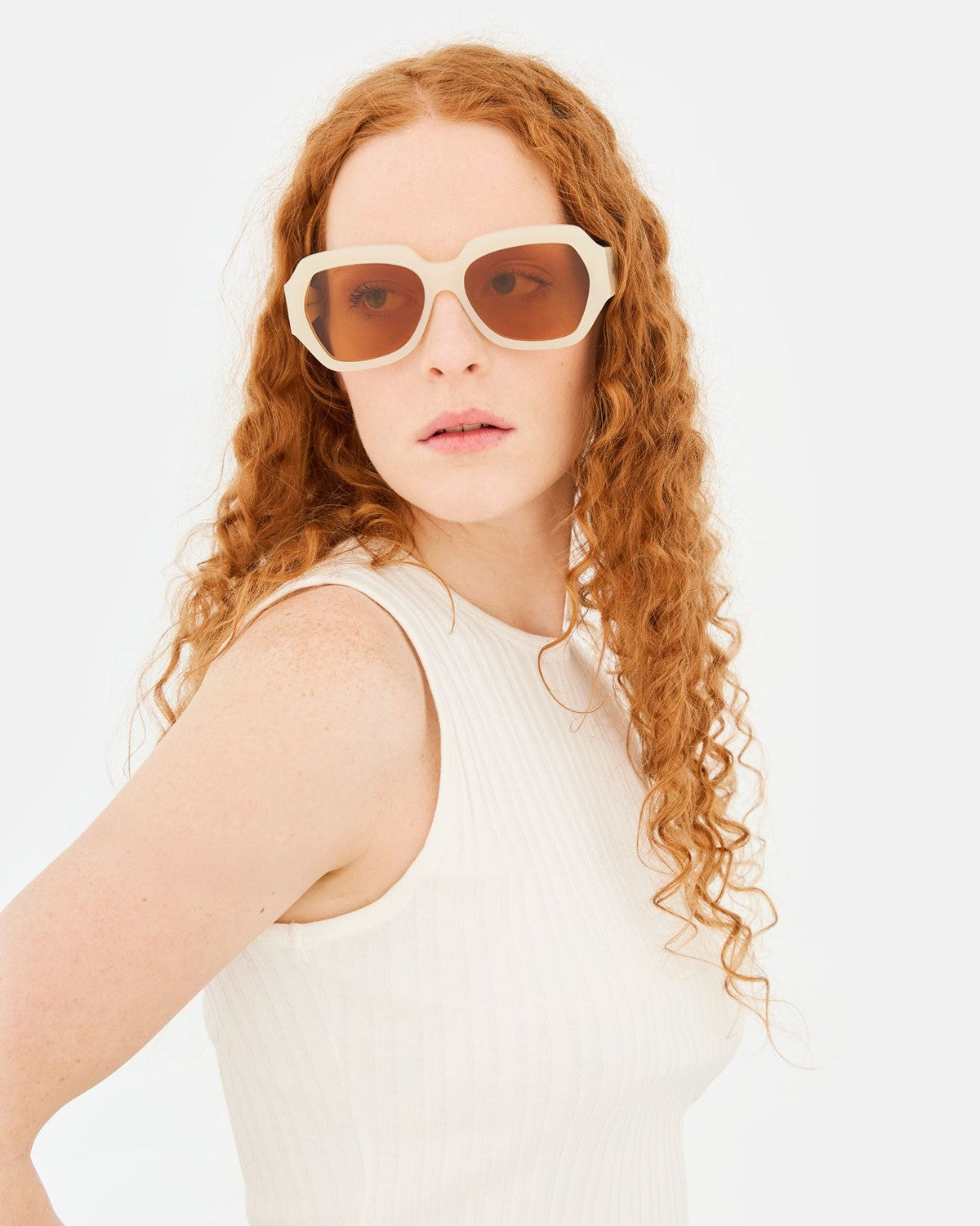 Front view of model wearing RETROSUPERFUTURE Nala Cremoso sunglasses.