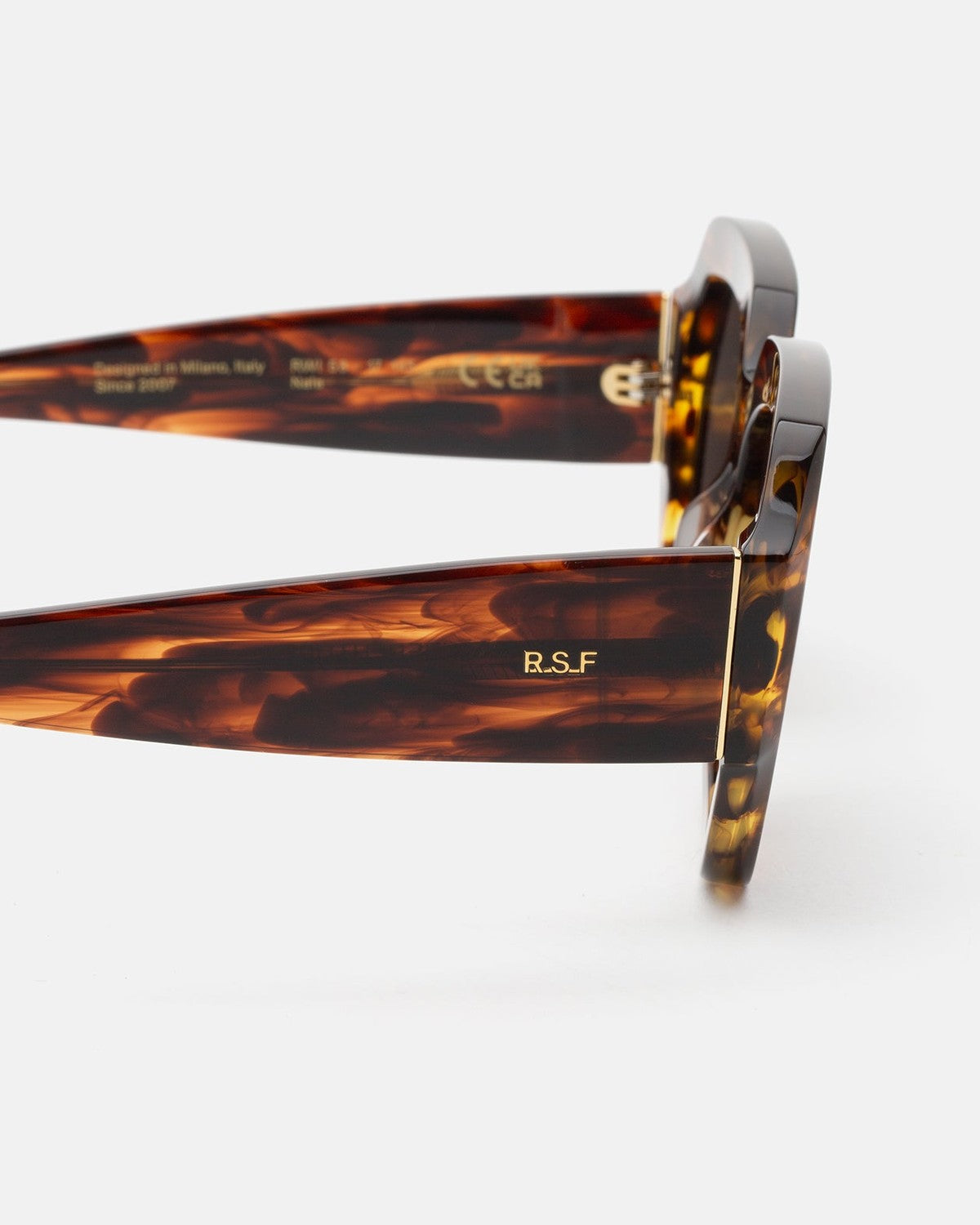 Close-up of the temple and R.S.F branding on RETROSUPERFUTURE Nala Havana Striata sunglasses.