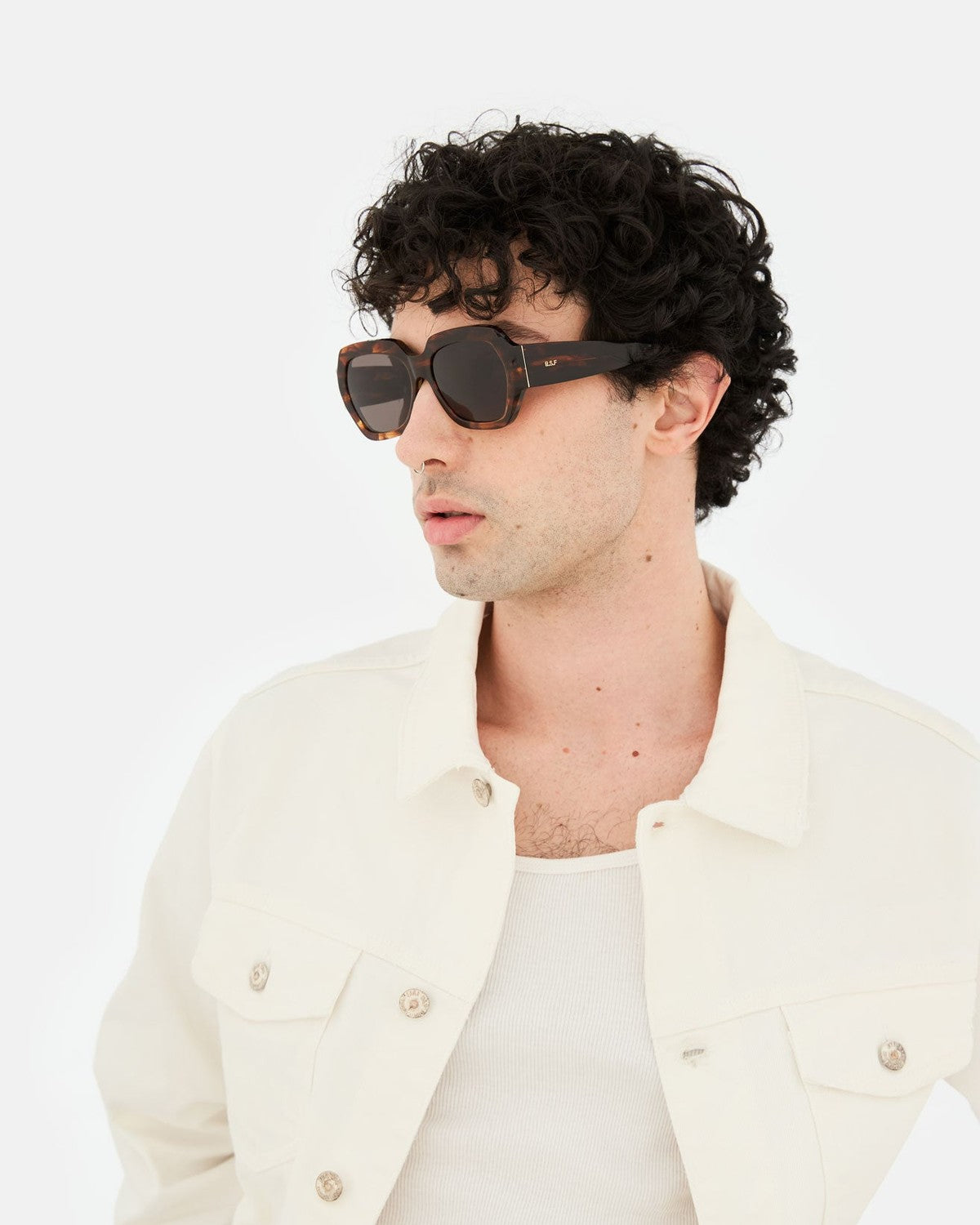Model wearing RETROSUPERFUTURE Nala Havana Striata sunglasses, side profile.
