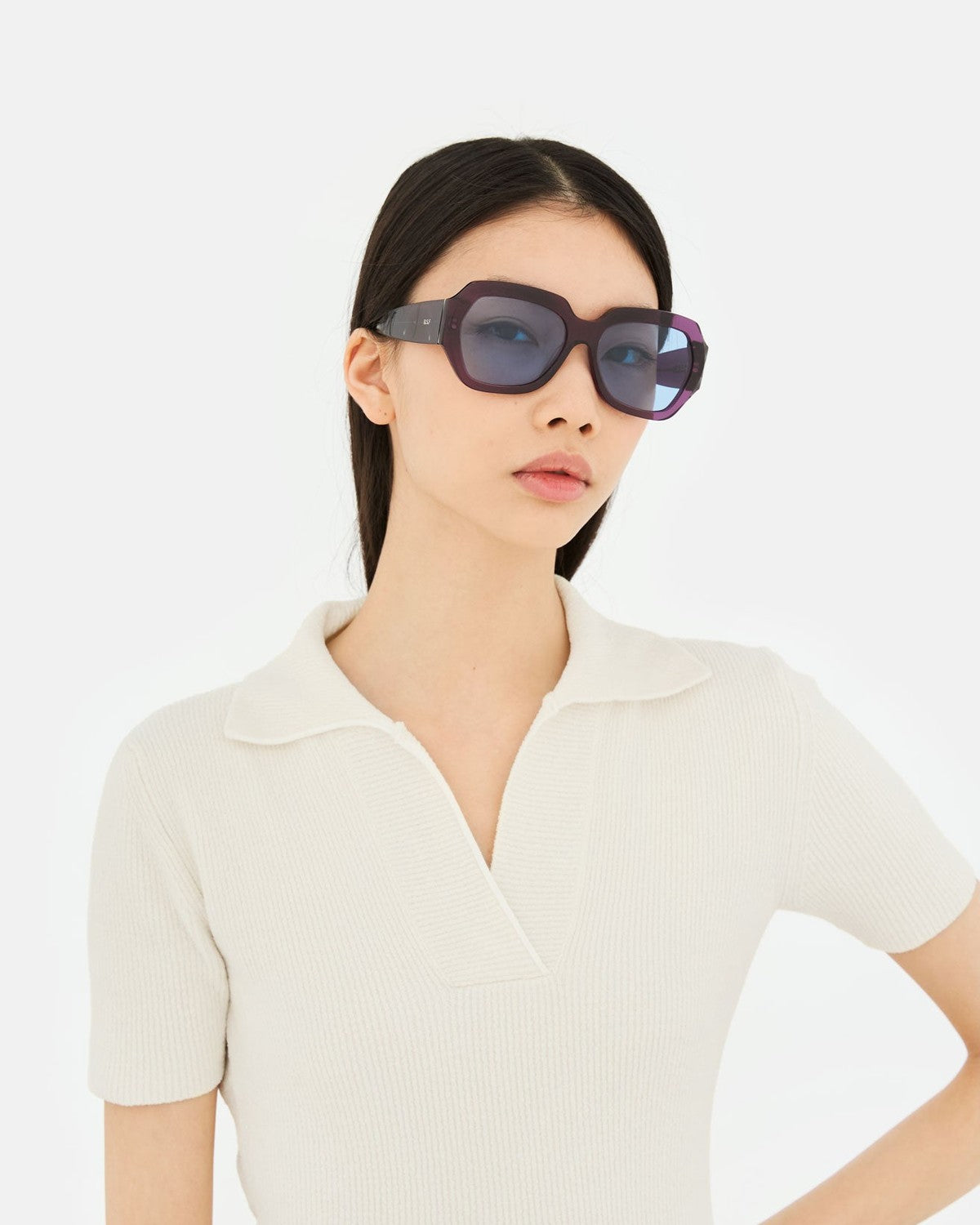 Model wearing RETROSUPERFUTURE Nala Melanzana sunglasses.