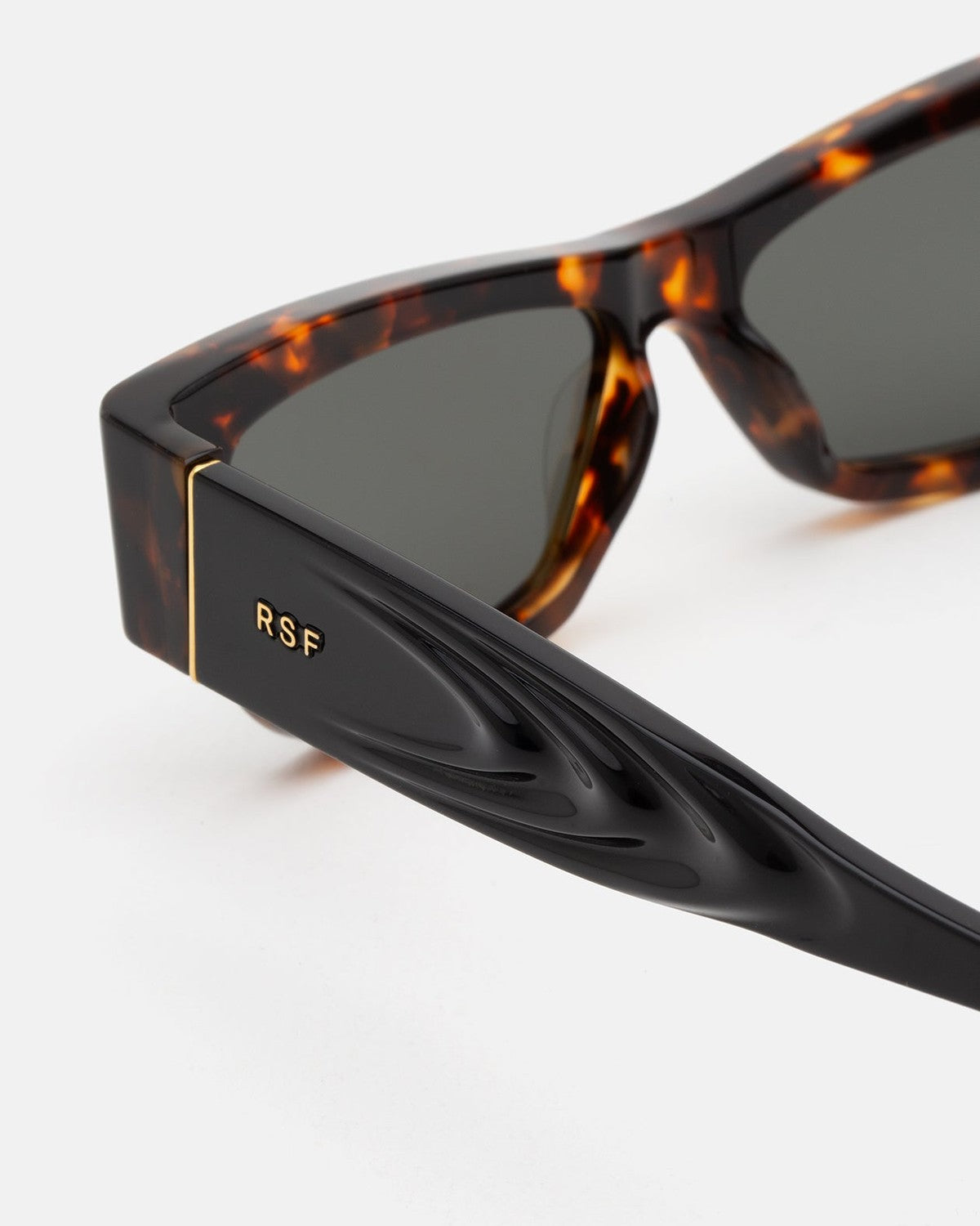 Close-up of the temple with RSF logo on RETROSUPERFUTURE Nameko Burnt Havana sunglasses.