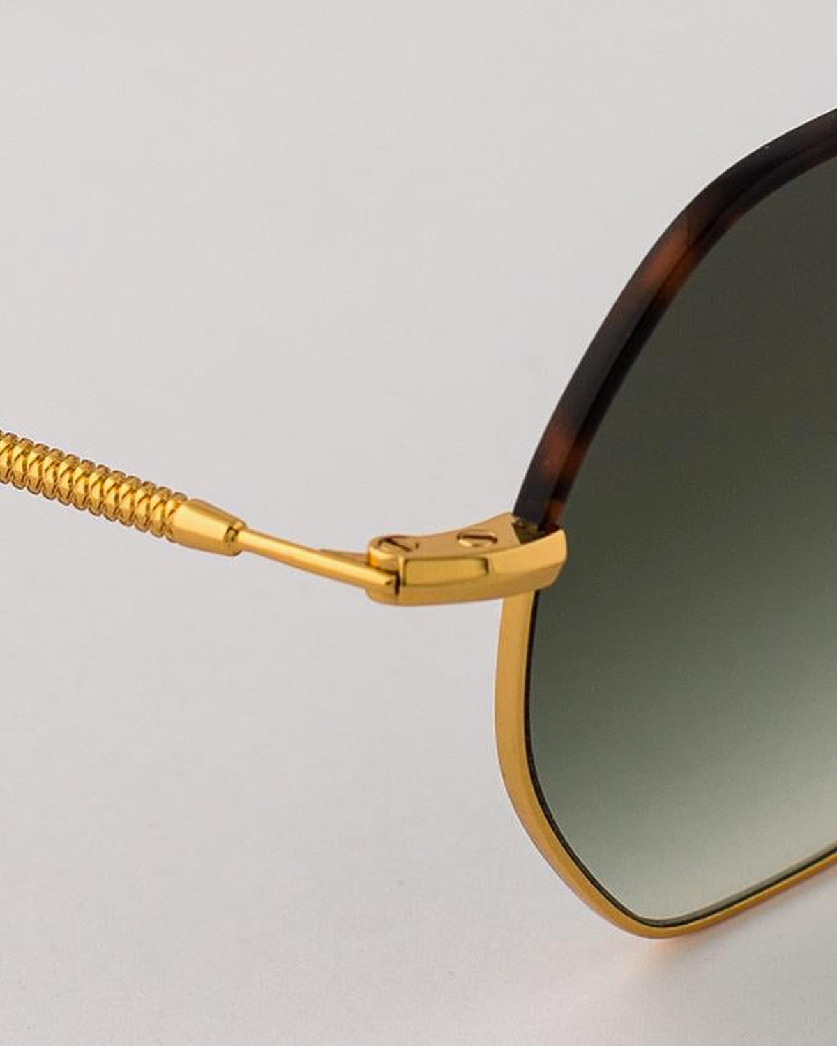 Close-up of the textured gold temple and hinge on EYEPETIZER NAMIB C.4-M-25 sunglasses.
