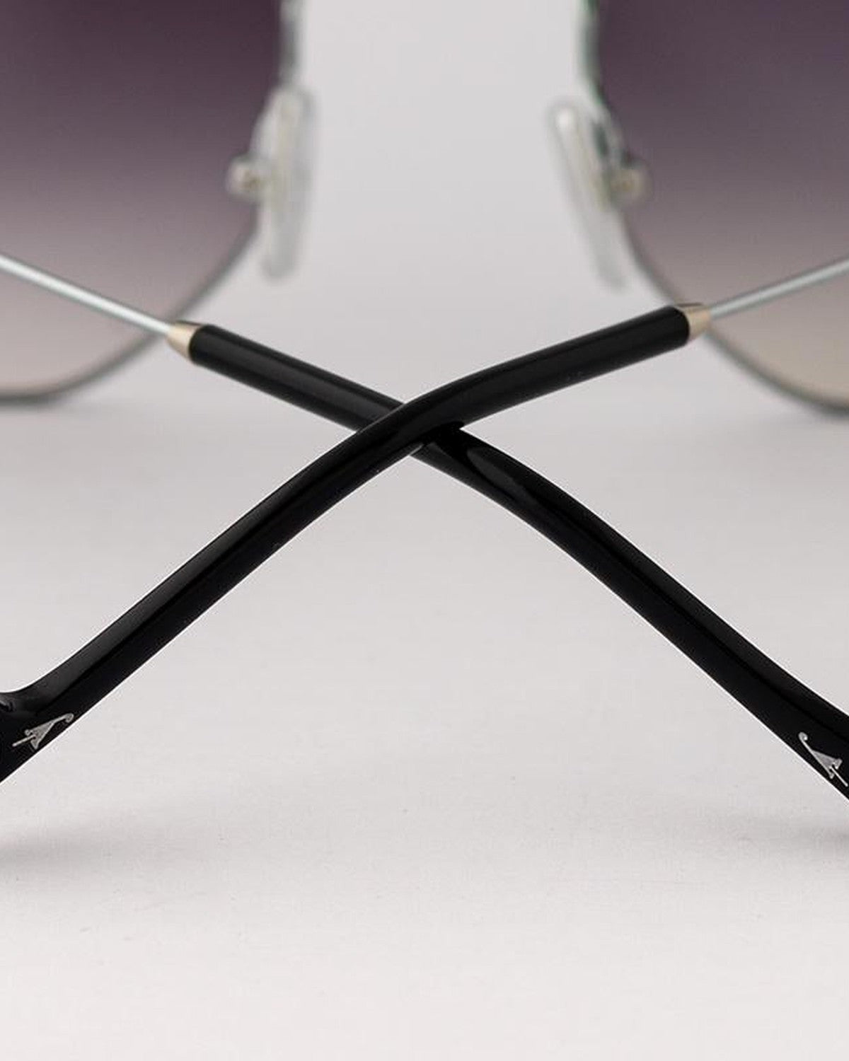Overhead detail of crossed temples on EYEPETIZER NAMIB C.1-A-27 sunglasses.