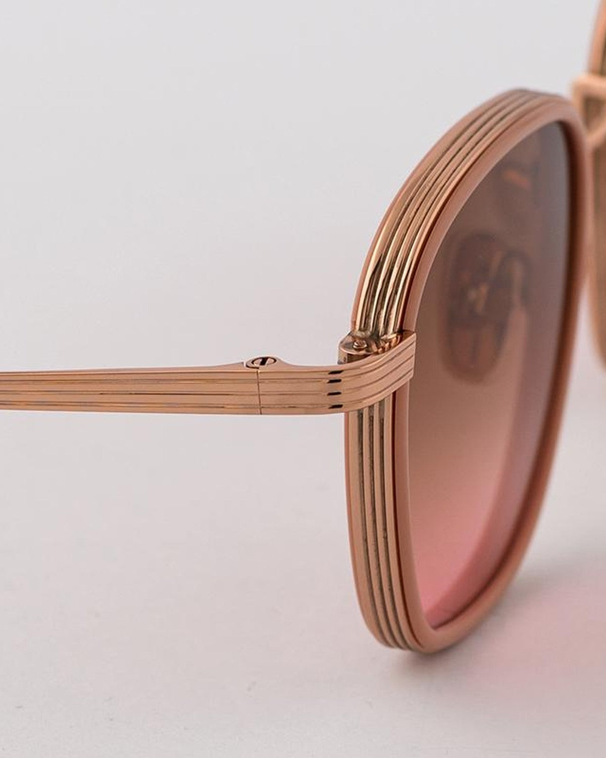 Close-up of the layered temple and hinge detail on EYEPETIZER NOMAD C.Q-9-44 sunglasses.