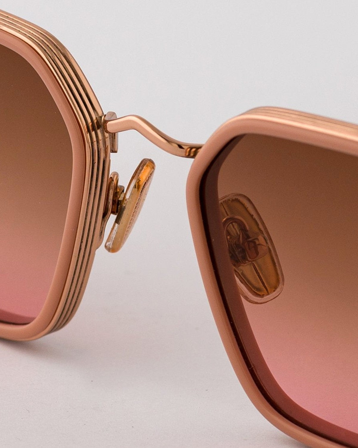 Detail of the metal bridge and embossed logo on EYEPETIZER NOMAD C.Q-9-44 sunglasses.