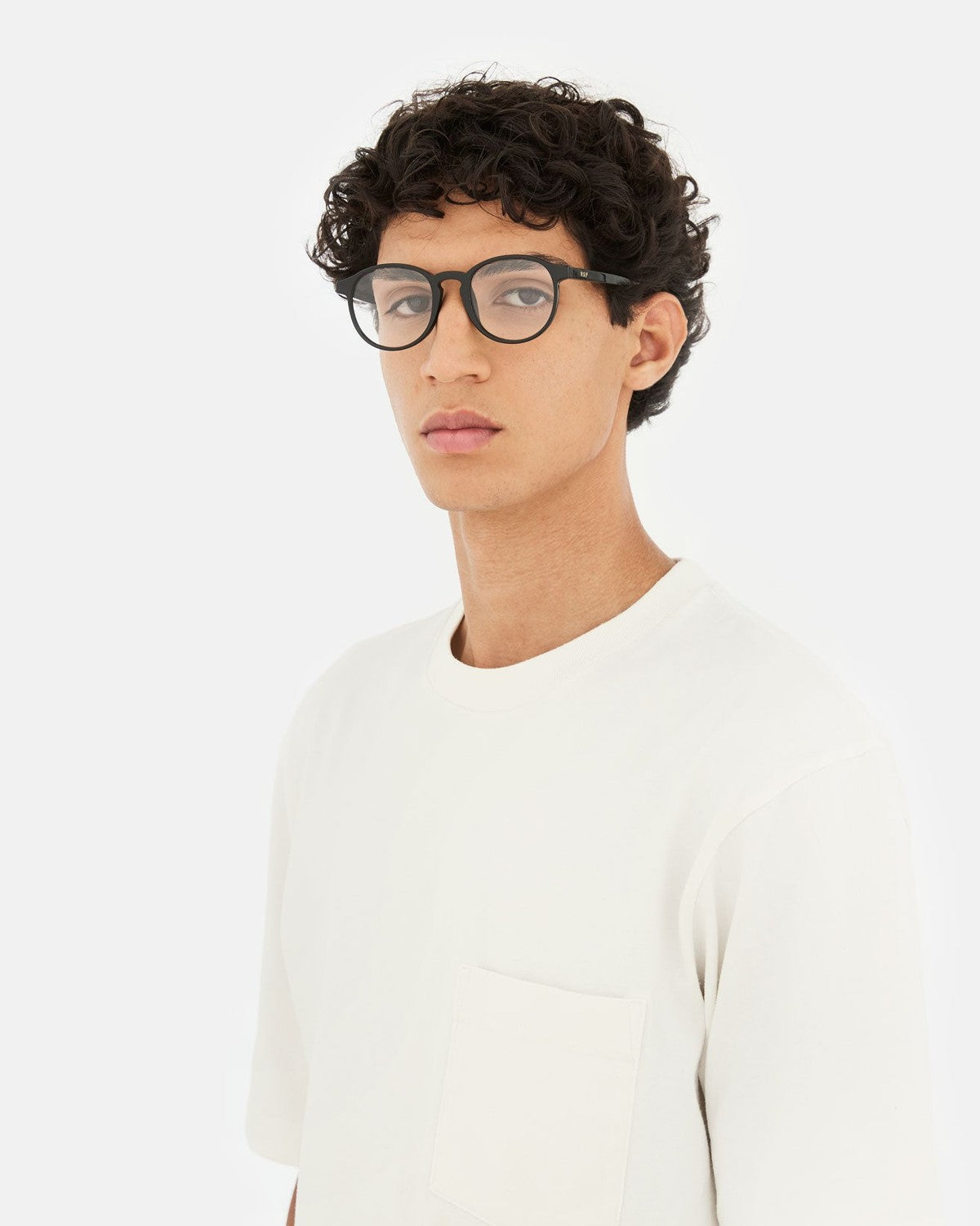 Model wearing RETROSUPERFUTURE Numero 01 Black sunglasses facing forward.