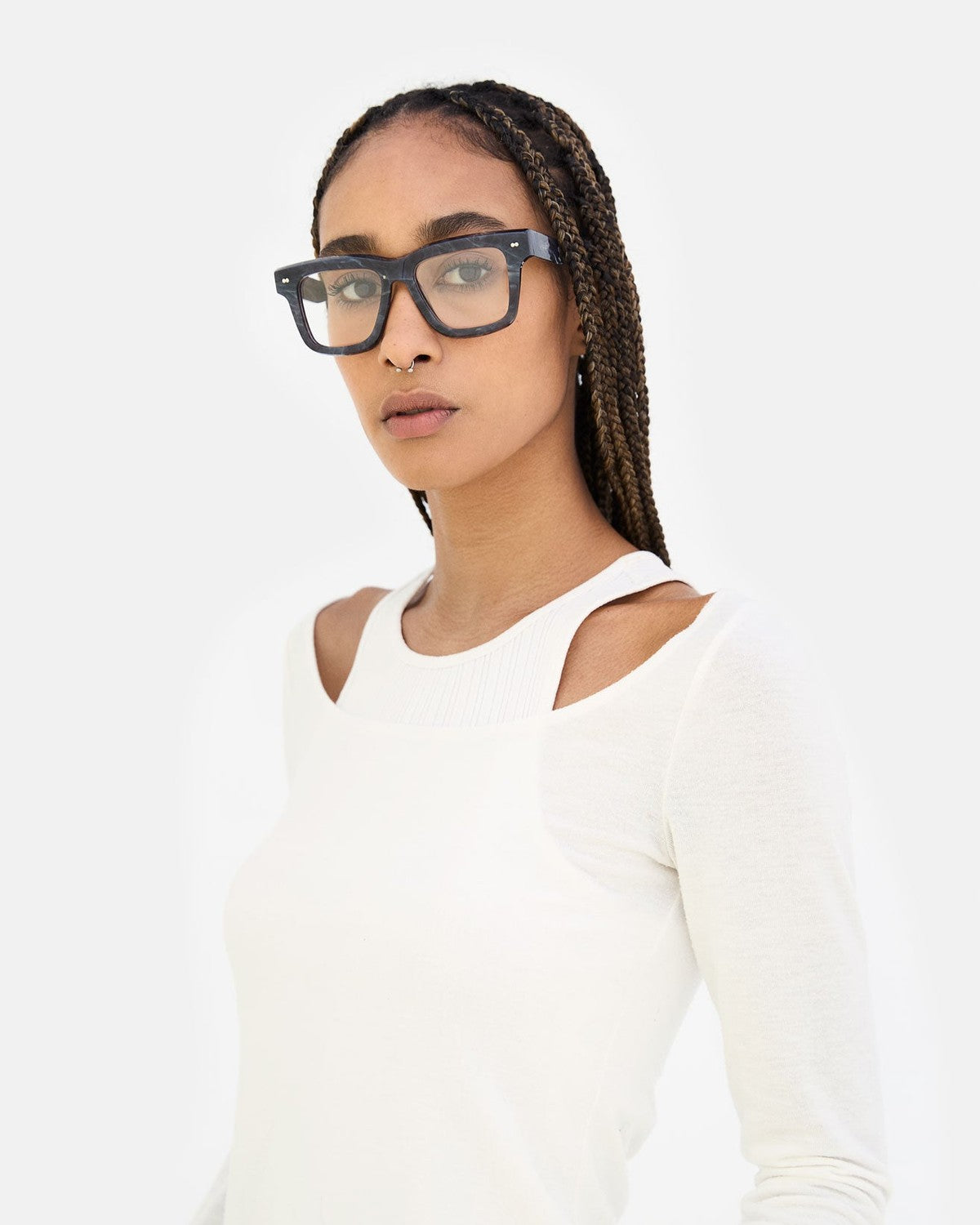 Model wearing RETROSUPERFUTURE Numero 116 Marmo Nero sunglasses in three-quarter view.