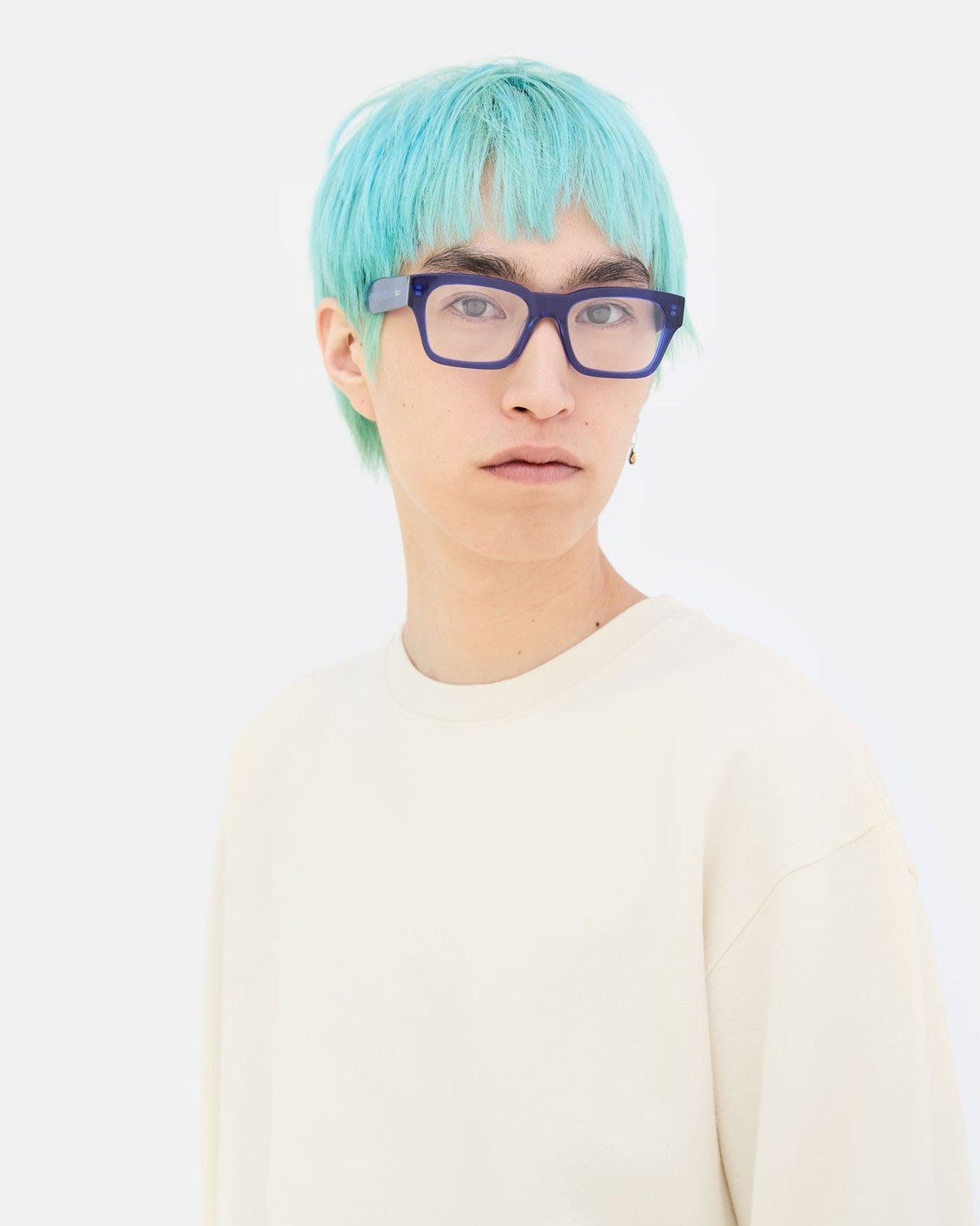 Model wearing RETROSUPERFUTURE Numero 119 Blue sunglasses in front view.