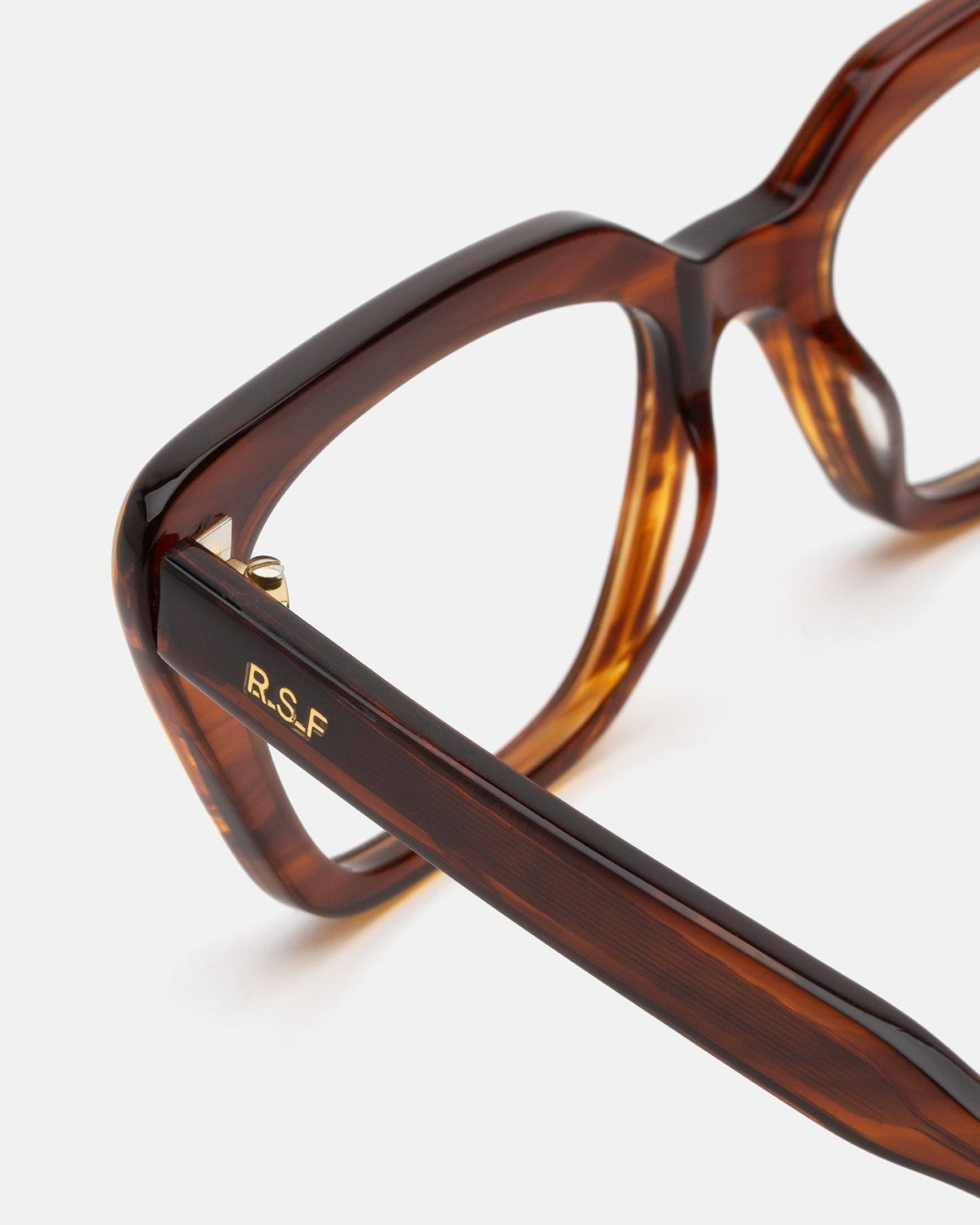 Close-up of the temple hinge and R.S.F branding on RETROSUPERFUTURE Numero 122 Havana sunglasses.