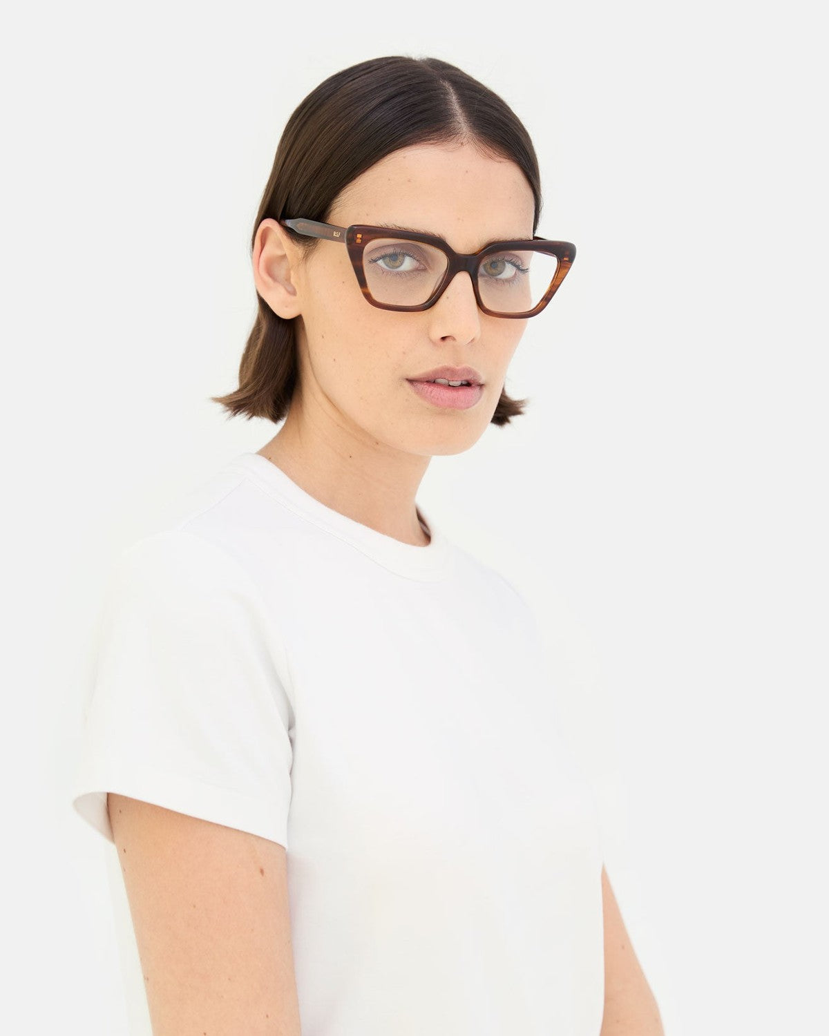 Model wearing RETROSUPERFUTURE Numero 122 Havana sunglasses in three-quarter view.