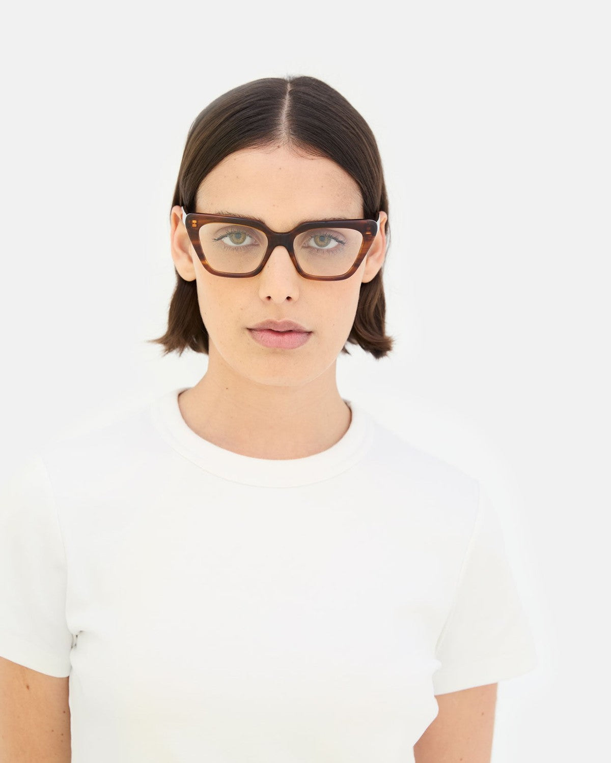 Model wearing RETROSUPERFUTURE Numero 122 Havana sunglasses in front view.