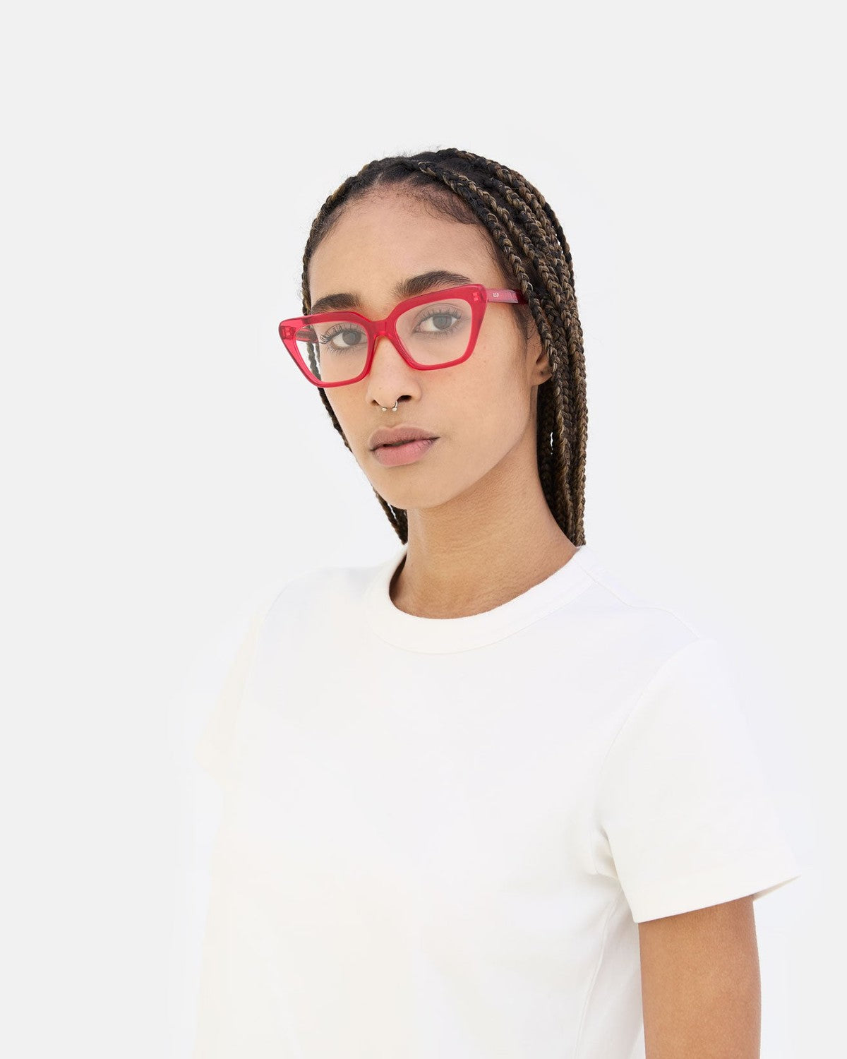 Model wearing RETROSUPERFUTURE Numero 122 Red sunglasses, angled pose.