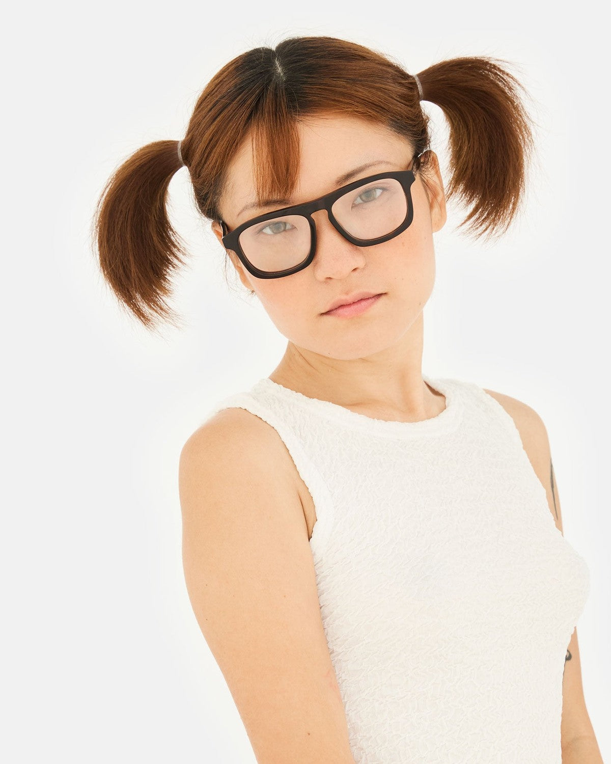 Model wearing RETROSUPERFUTURE Numero 123 3627 sunglasses with pigtails.