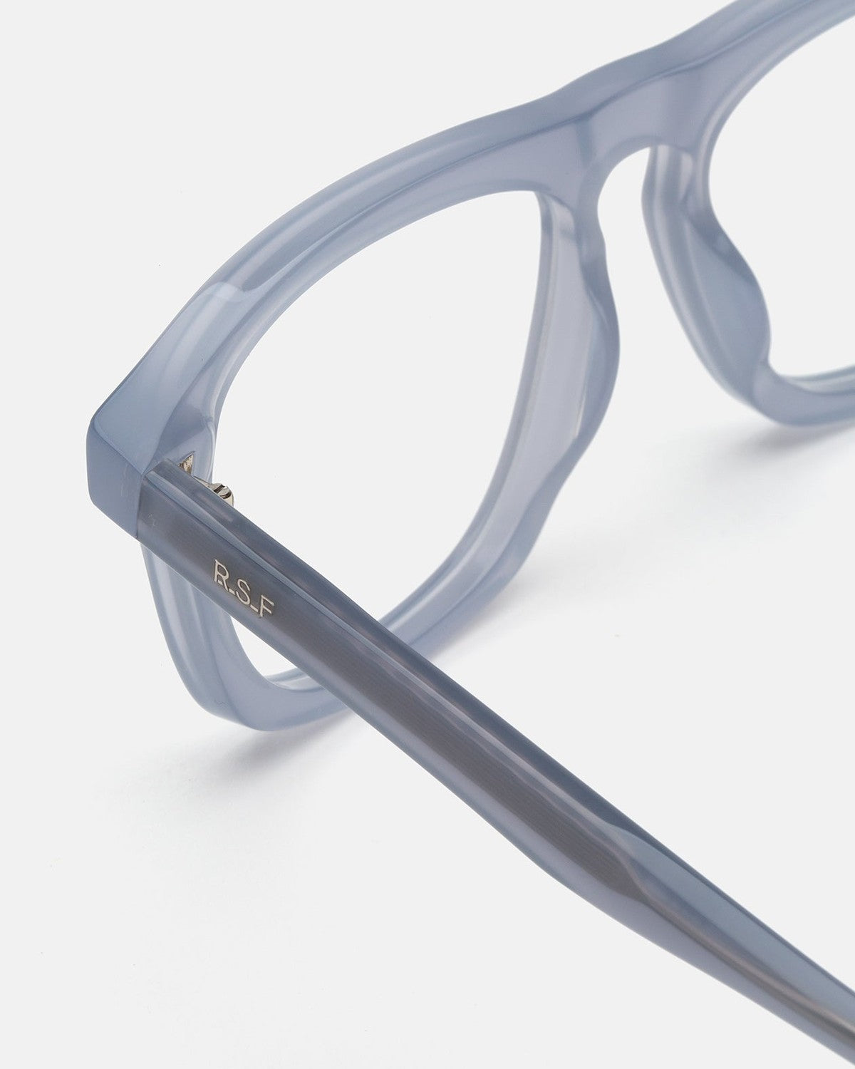 Close-up of the temple with R.S.F logo on RETROSUPERFUTURE Numero 123 Light Blue sunglasses.