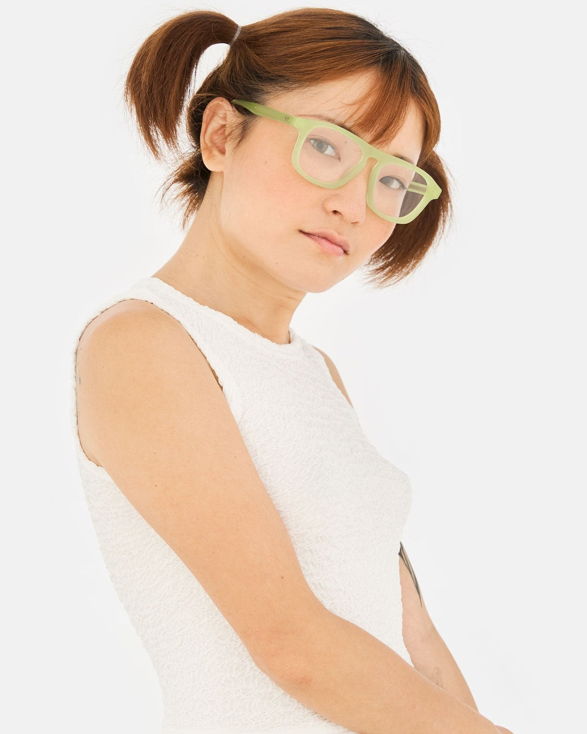 Model wearing RETROSUPERFUTURE Numero 123 Lime sunglasses.